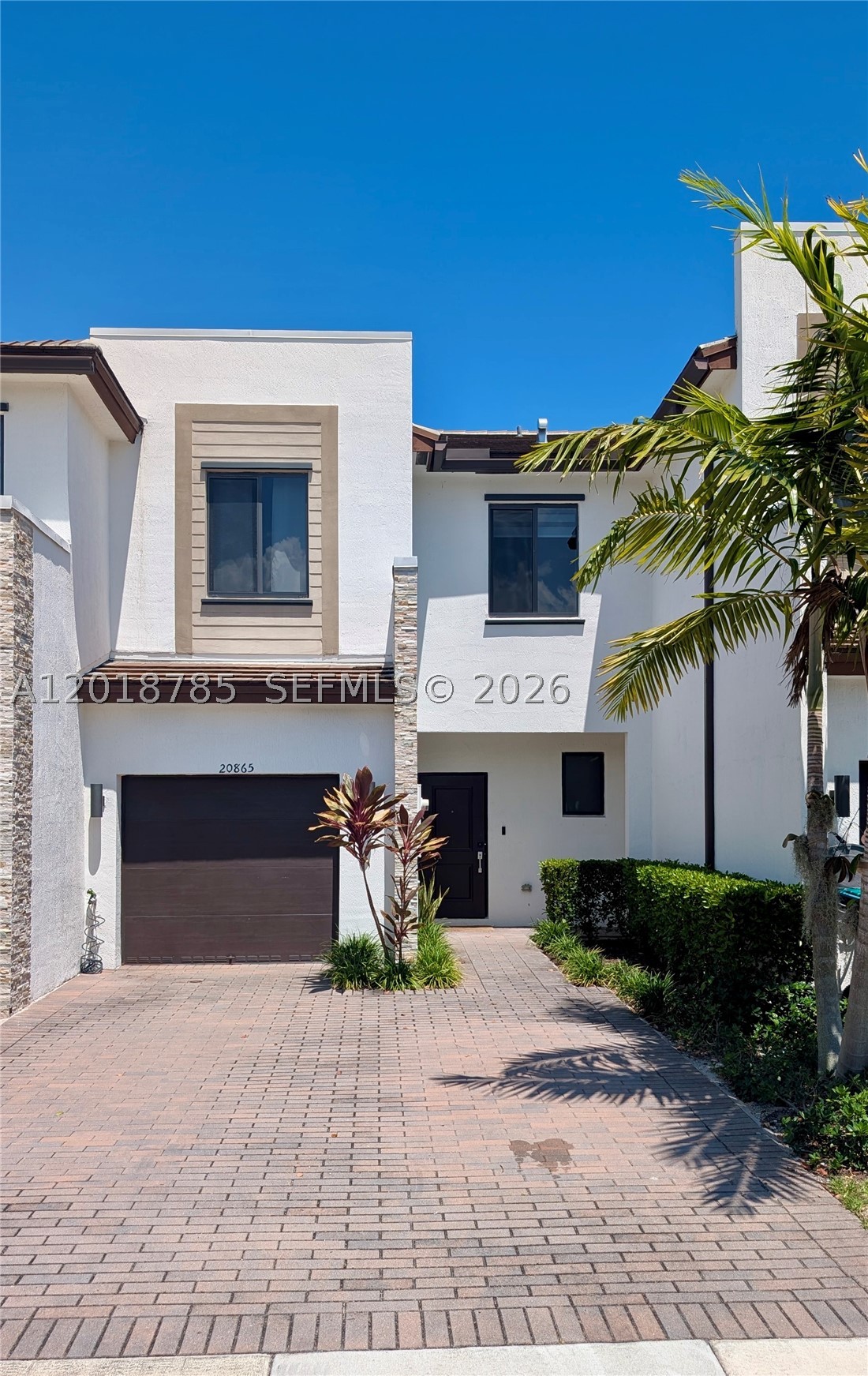 Step into contemporary luxury with this fully renovated 3BR/2.5BA smart townhome in the sought-after gated community of Via Ventura. Built in 2021 and upgraded far beyond developer finishes, this home features elegant 48x24 porcelain tile on the main level, premium vinyl flooring upstairs, and a designer kitchen with sleek cabinetry, black & stainless appliances, and a dramatic waterfall island perfect for entertaining.

This true smart home is equipped with Alexa-integrated controls, Ring security, keyless entry, app-controlled garage door, smart water valve/monitoring system, remote retractable deck awning, and an intelligent toilet—bringing comfort and convenience to a new level.

Enjoy resort-style living with a staffed clubhouse, social lounge, state-of-the-art fitness center, lakefront pool with panoramic views, soccer field, and lakeside park with playground. Ideally located just minutes from Aventura Mall, world-class dining, beaches, and top-rated schools.

A rare turnkey opportunity in one of Miami’s fastest-growing communities—move right in and start living the lifestyle.