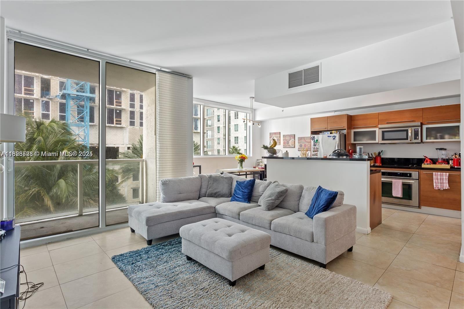 Corner Unit in the Heart of Downtown Miami! Spacious 1 BR + Converted Den/ 2 Full Baths.(approximately (1,146 sq ft) The den converted to a second bedroom. Very light and bright condo facing the pool. The kitchen has high-end Stainless Steel appliances & granite countertops. 2 Full bathrooms with marble floors, showers & glass doors. Ample walk-in closet. Full-size washer & dryer. Unit comes with 1 parking space and 1 storage unit. The condo offers 5-star resort-style amenities; 4 tropical pools, a jacuzzi, spa, gym & 24-hour lobby receptionists, and security. The reserves are fully funded. Easy to show!