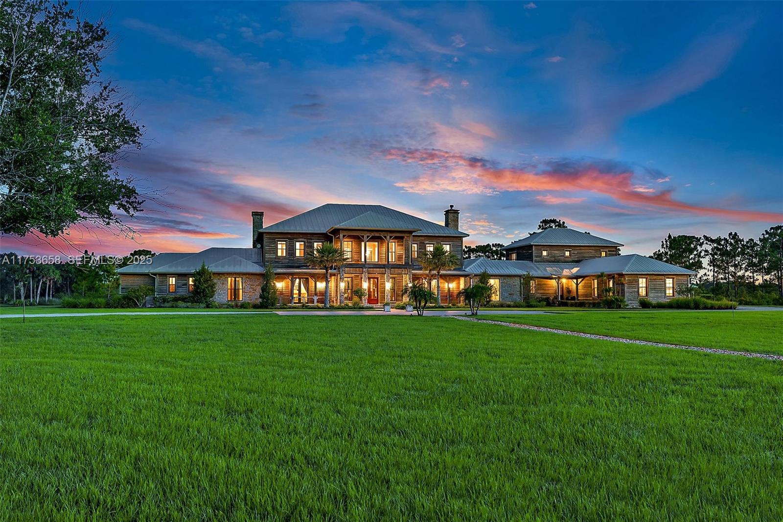AUCTION BIDDING OPEN: Bidding ends May 29. Previously listed at $14.995M. Current high bid $6M. Showings by Appt. PineHaven Sporting Ranch presents an extraordinary opportunity within the exclusive Pine Creek Sporting Club—dubbed "the millionaire's gun club" by CNBC. This magnificent Adirondack-inspired estate blends rustic warmth with sophisticated luxury across 40 pristine acres of Florida uplands. The grand entrance captivates with soaring beamed ceilings and natural materials, setting the tone for a residence designed for both intimate family gatherings and lavish entertaining. Generous living spaces flow seamlessly between the elegant bar and billiards area to the impressive trophy room and art gallery. The covered loggia extends outdoor living with a professional pizza oven and