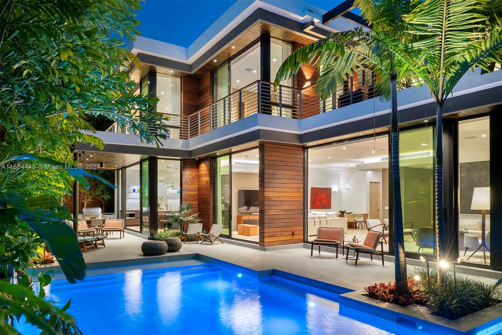 Stunning, new construction tropical modern home on a serene street in coveted North Coconut Grove, offers 7,146 SF adj of luxury living. Designed by renowned architect Charles Treister, the 6-BD, 7-BA, 2-half BA home is set on the coastal ridge 18 FT above sea level amidst lush gardens, capturing the essence of a tropical paradise. A chef’s kitchen includes premium appliances, marble countertops & ample seating. The spacious 2-RM primary suite has a separate sitting area, 2 walk-in closets, 2 BA & private terrace. Additional luxuries include a whole-house generator, elevator, Savant smart home system, versatile basement space, 2-RM guest suite w/ kitchenette & underground utilities. Outdoor areas feature a heated saltwater pool, spa, covered patio, summer kitchen & outdoor shower.