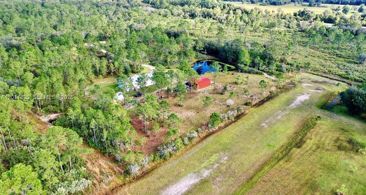 FOR SALE *Private 6.31-Acre Retreat on Airstrip* part owner of Lake Montaza Airport (83FD) Imagine owning a non-restricted land nestled in a quiet cul-de-sac with no neighbors on 3 sides. This rare property offers a lifestyle of peace privacy & unmatched access to nature with gate access to the private airstrip and a secondary utility entrance. At 1,484 sq. ft this 3 bed 2 bath home is thoughtfully designed for both relaxation & functionality. Primary suite with kingsize bed large closet, & a woodland view office nook master bath soaking tub / oversized shower dual sinks & linen cabinet 2nd bedroom, bunk beds, futon & a spacious closet 3rd bedroom with a queen bed. Kitchen includes a power equipped island with seating for 4 & a large walkin pantry dining room with seating for 8 & a corner bar. A mud room houses a full-size W/D with space for boot & coat racks The spacious family room offers a cozy gathering space with a couch & love seat. Outdoor amenities make this property truly unique 10'x18' outdoor kitchen with large stainless steel sink, fish pond for peaceful private fishing, large chicken coop, 30' x 20' steel barn with 12' x 30' lean-to porch, Grand gated entrance fully fenced, underground utilities, & abundant wildlife. With no native land encumbrances, you have the freedom to enjoy & develop the land as you wish. Whether you're a homesteader, hobbyist, aviator, or nature lover, this property is ready to support your dream lifestyle. Don't miss this rare opportunity