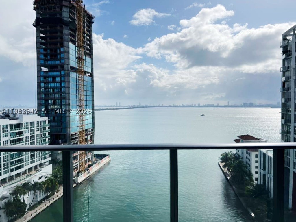 Experience the pinnacle of Edgewater luxury in this designer-inspired, 2-bedroom, 2-bathroom sanctuary perched on the 14th floor of the prestigious Icon Bay. Spanning 1,095 square feet of sleek living space, this residence features a private foyer, Italian porcelain floors, custom closets, and designer lighting throughout. Floor-to-ceiling windows flood the open-concept layout with natural light, showcasing breathtaking, direct panoramic views of Biscayne Bay from every room and your private balcony. The primary suite serves as a refined retreat with an en-suite bath and high-end window treatments. Residents enjoy five-star, resort-style amenities, including an infinity-edge bayfront pool, state-of-the-art fitness center, spa, tennis courts, theater room, and a private waterfront park with curated art installations. Strategically located just minutes from the Design District, Wynwood, and Midtown, with Whole Foods and elite dining just around the corner. Unit includes one assigned parking space, 24/7 concierge, and valet service.