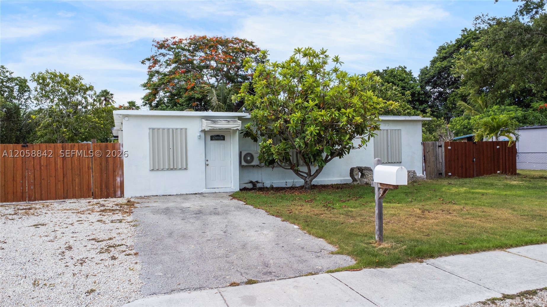 This versatile 4-bedroom, 2-bath home offers a flexible layout that can be configured into two separate living areas, each with its own private patio. One side features a full kitchen, while the other is equipped with plumbing for a future kitchen.
The sale includes an RV with dedicated utility hookups and its own private outdoor space, creating even more flexibility and value.
Perfect for multigenerational living, extended family, or buyers seeking a property with exceptional versatility and income potential. Conveniently located near shopping, schools, major highways, and the Florida Keys.