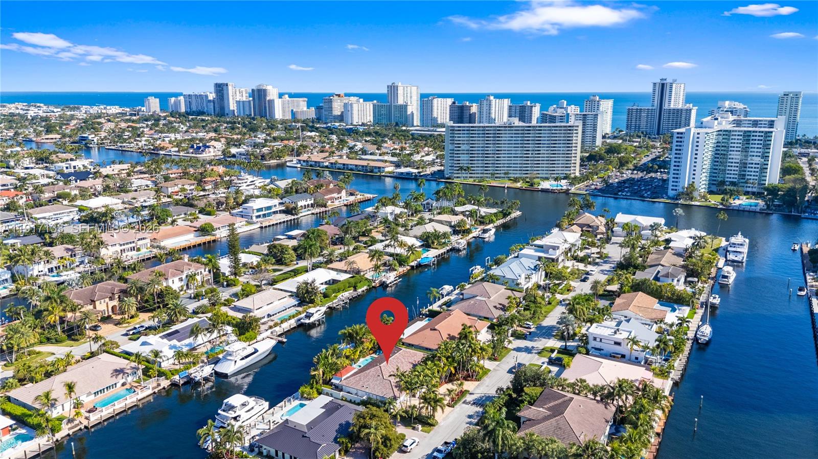Indulge in this luxurious waterfront retreat in Coral Ridge, where sophisticated living meets boater’s paradise. Boasting 100’ of premium dockage on a wide, deep canal with unrestricted ocean access, a 35,000-lb boat lift, and exceptional comfort, this 4 bed, 3.5 bath residence embodies the waterfront lifestyle. A dramatic great room, expansive dining area, and a chef’s kitchen with top-tier Viking appliances and ADORNUS cabinetry, custom Cambria quartz counters are ideal for grand entertaining or quiet moments. Every space has been remodeled, from serene bedrooms to spa-style baths. Master bath recently updated with 24x24 Greek marble and custom his-and-hers cabinetry with exotic Cristallo quartzite countertops and a spacious shower. Jack and Jill bath features Cambria quartz, porcelain surfaces, generous storage, large mirror, and recessed lighting, while bath #3 offers quartz, travertine, custom cabinetry, and a statement mirror, plus a chic powder room with premium stone counters. A climate-controlled garage includes epoxy floors with space for toys. Whole-house gas generator. Exterior upgrades include new barrel tile roof, gutters, marble pavers, and lush landscaping and lighting enhancing curb appeal. Partial storm shutters and impact glass. Close to beaches, shops, dining, and top schools, this is a rare, turnkey waterfront opportunity.