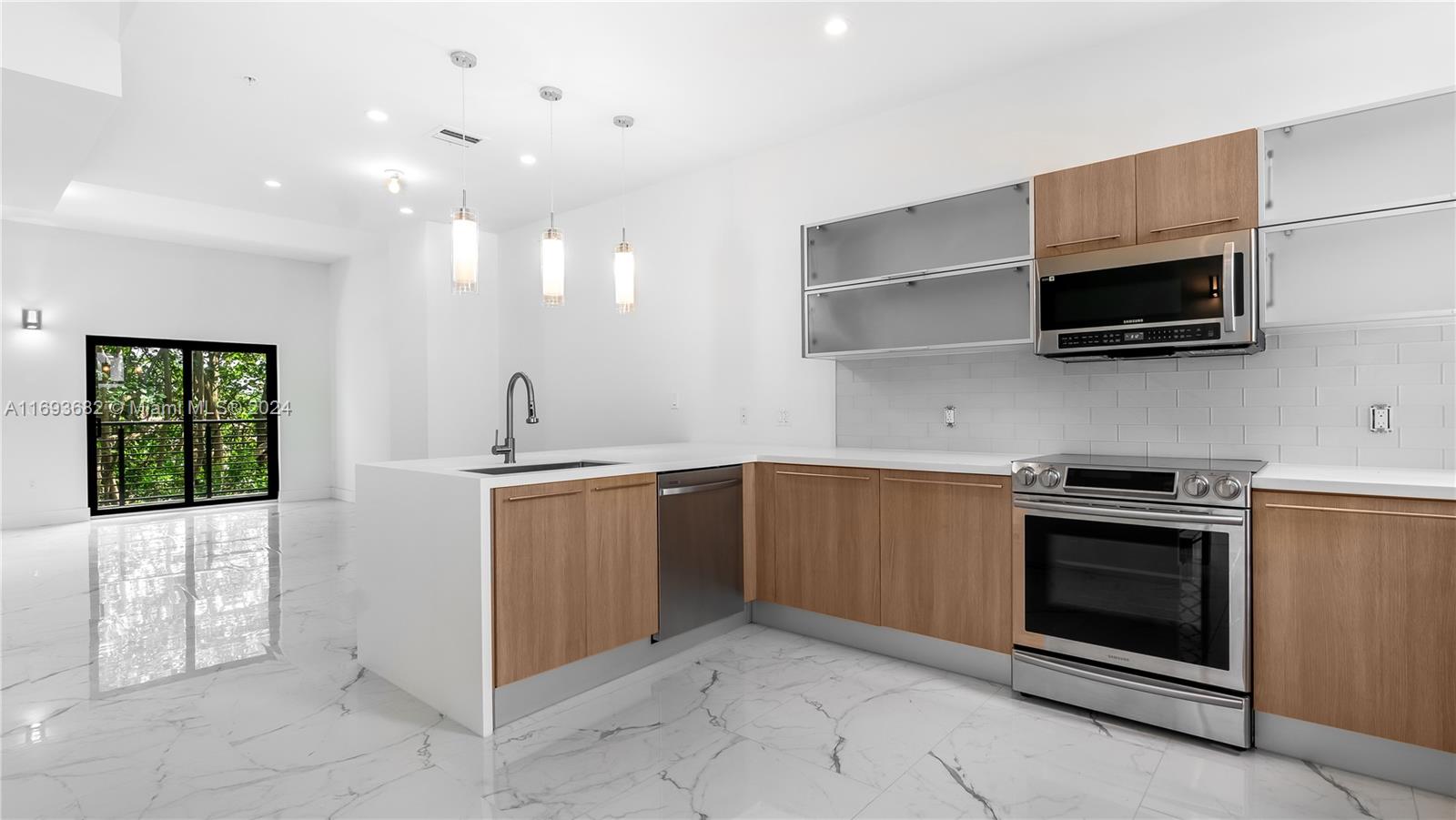 Live the dream and be the first to make this brand new, modern multi-story townhome just 5 minutes from the beach your new home. This 3 bed 3 1/2  three story luxurious  townhome welcomes you to a beautiful open concept kitchen, new stainless steel appliances, balcony in every floor, privacy with full baths inside every bedroom,high ceilings, garage, canal view, and so much more. Koi Residences offers a gorgeous pool overlooking the marina, upscale club house, fitness center and even doggie park!!!