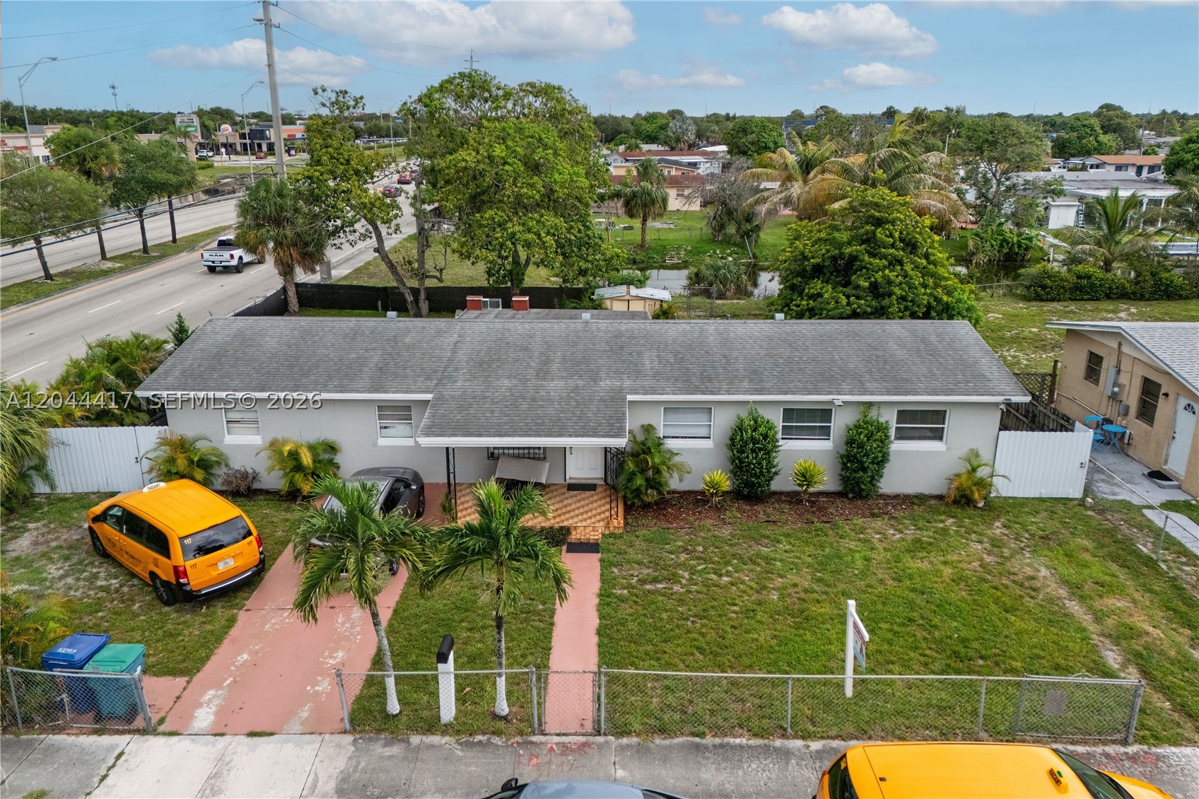Large CORNER 4 bedroom house with a unique flexible design, great for big families or for an in laws quarters. Very desirable part of Miami Gardens, Home features newer roof. Located in a well-connected area with major supermarkets such as Costco, Walmart, BJ's, and more.BROAD PARKING FOR MORE THAN 6 CARS ,EXCELLENT  INVESTMENT PROPERTY. Text for showings