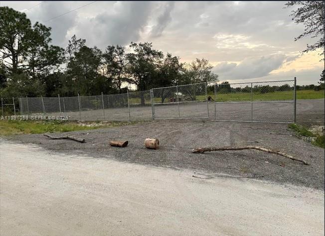Welcome to Montura Ranches! This beautiful 1.25 acres is ready for you to build your dream home.  This vacant land is perfectly situated just south of Hunting Club Road. The community offers a Clubhouse featuring a swimming pool, recreation facilities, parks, a playground, and basketball courts.  Its center also hosts after-school programs and summer camps for kids, and the Early Childhood Center is next door.  Montura also has a private reservoir for the landowner use that allows house back riding, camping, fishing, and hunting.  Healthy rural living, Certified Land Survey Layout and plan layout of the property available.  Half of the property has been filled with asphalt rap spread and compacted.  Fully fenced 20' wide gate.  Asphalt driveway and drainage pipe approved by county.
