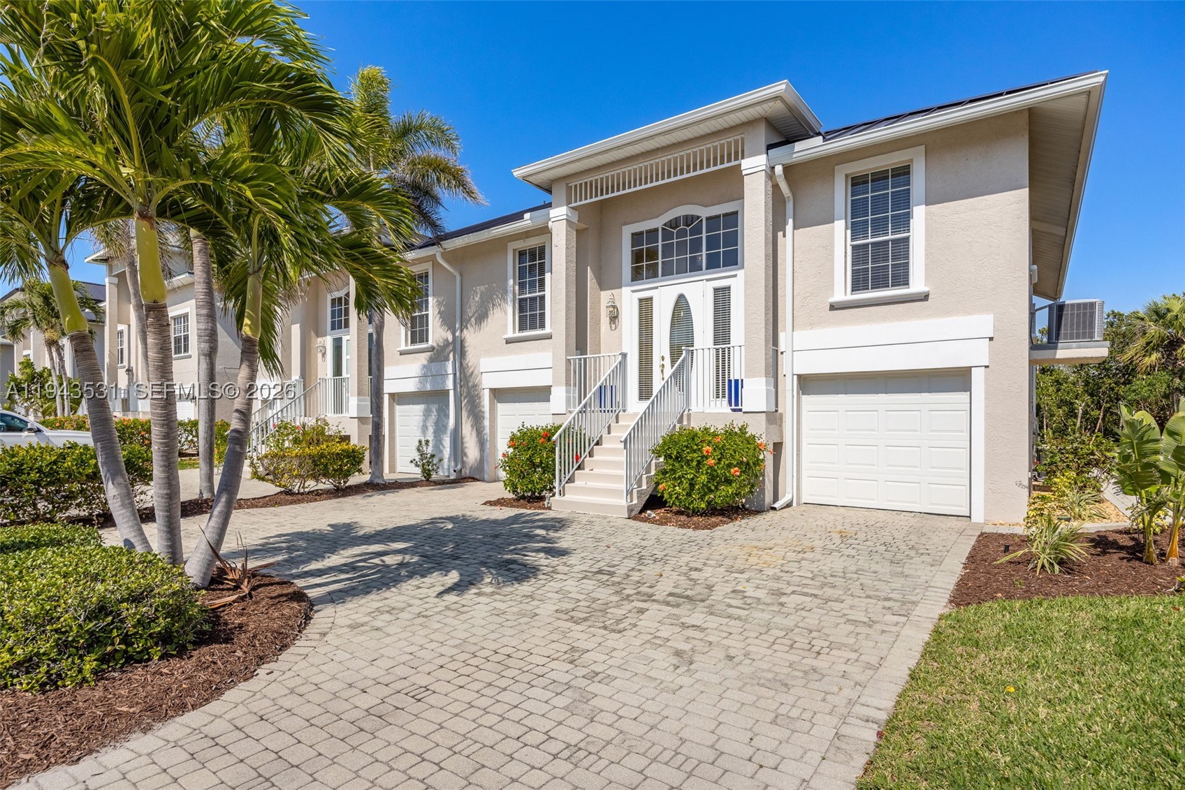 Best-priced concrete block (CBS) waterfront villa in Fort Myers Beach, located in the desirable Old Pelican Bay community and offering the rare advantage of TWO docks. This hurricane-proven, two-story villa sustained no hurricane damage, with all main living areas elevated on the second floor for added protection, views, and coastal breezes. Recent upgrades include a 2024 metal roof, 2024 HVAC, 2023 hot water heater, and 2023 pool equipment, plus a 1-year home warranty. The light-filled open layout features serene water views, a private primary suite, guest bedrooms with ensuite baths, an upstairs balcony, and a private pool. Dock #16 includes a 10,000-lb boat lift, offering easy Gulf access for boating and fishing, while a transferable flood policy (~$1,200/year) enhances affordability. Just minutes from Fort Myers Beach, dining, shopping, and entertainment—this is a rare opportunity to own a durable, low-maintenance waterfront villa with exceptional value.