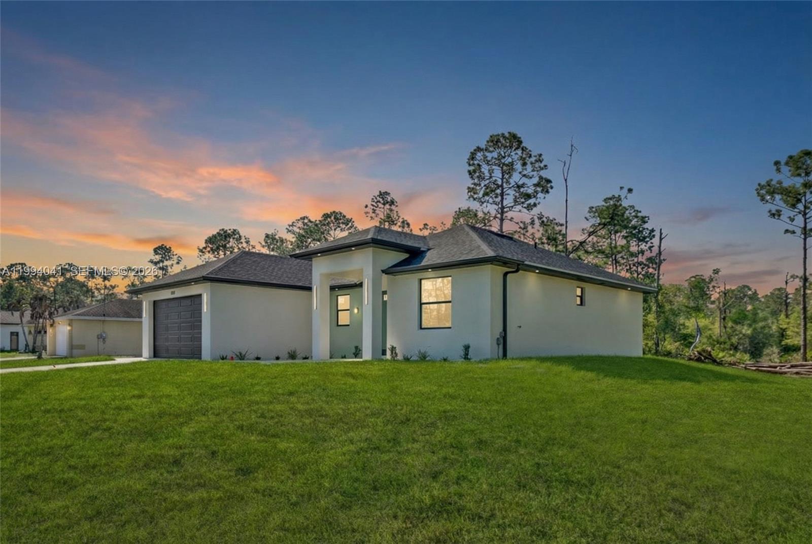 Brand-new construction in Lehigh Acres! Beautiful 3-bedroom, 2-bath home with 2,288 total sq ft, 1,540sq ft under air, and a spacious 2-car garage. Featuring soaring high ceilings, impact-resistant windows and doors, quartz countertops, an open-concept kitchen, separate laundry room, and premium finishes throughout. The primary suite offers a walk-in closet and private bath. Enjoy the covered lanai with plenty of backyard space for a pool or outdoor entertaining. Epoxy-finished garage floor and move-in ready. Great opportunity at an attractive price!