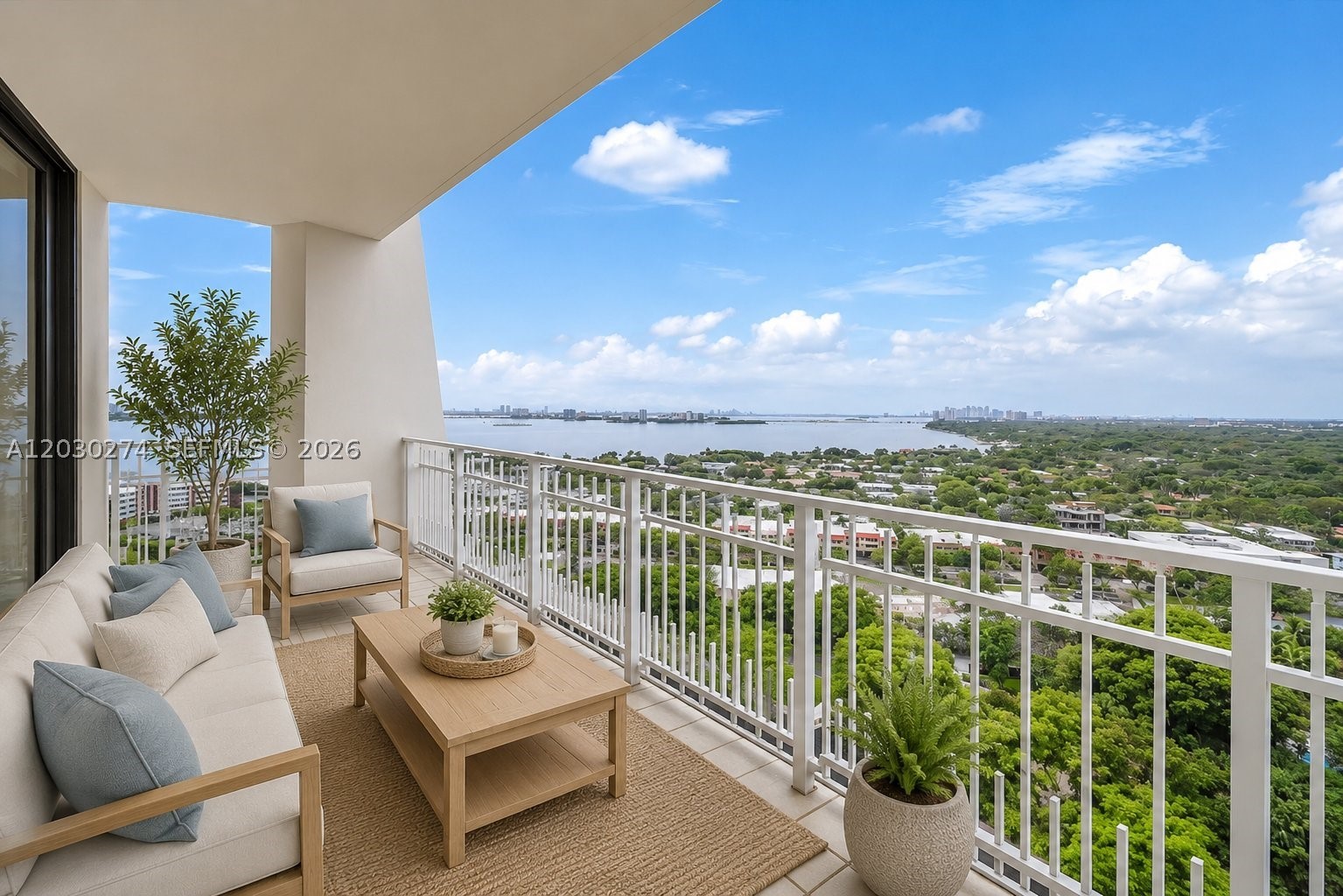 Enjoy sweeping views of Biscayne Bay, the Miami skyline, and lush tropical surroundings from this Top-Floor unit. An expansive balcony creates a seamless connection between indoor and outdoor living, providing multiple vantage points to take in the water and city views. The unit features an open living and dining area designed to maximize natural light and showcase the spectacular view. The primary suite includes balcony access, a large closet, and a bath with dual vanities and a soaking tub. 2nd bedroom provides flexibility as a second bedroom or a home office.   The oversized terrace is ideal for relaxing, entertaining, or dining.  Located within the gated Quayside community, residents enjoy access to resort-style amenities including fitness facilities, tennis and pickleball courts, swimming pools, marina access, dining venues, walking paths, and 24-hour security. A rare opportunity to enjoy spacious living, exceptional views, and an amenity-rich waterfront lifestyle in one of Miami's premier gated communities.