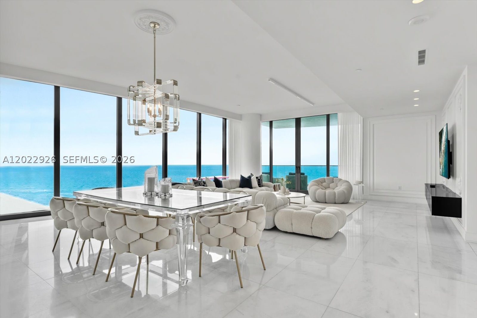 Experience elevated oceanfront living in this spectacular corner flow-through residence in the coveted South Tower at The Estates at Acqualina. Residence 1801 showcases breathtaking panoramic views of the Atlantic Ocean, Intracoastal Waterway, and city skyline through floor-to-ceiling glass and expansive terraces.

Designed with timeless elegance and contemporary sophistication, the residence features grand living and dining areas, a gourmet chef’s kitchen with premium appliances, custom cabinetry, stone countertops, and a large center island ideal for entertaining.

The luxurious primary suite offers stunning ocean views, custom walk-in closets, and a spa-inspired marble bath with a freestanding soaking tub and oversized shower. Spacious guest suites provide privacy, comfort, and beautifully appointed en-suite baths.

Residents enjoy access to The Estates at Acqualina’s unmatched collection of five-star amenities, including private beach service, multiple pools, world-class spa, fitness center, bowling lanes, ice skating rink, Formula One simulator, movie theater, concierge, valet, and exceptional dining.

A rare opportunity to own a turnkey corner residence offering the ultimate Acqualina lifestyle in the heart of Sunny Isles Beach.