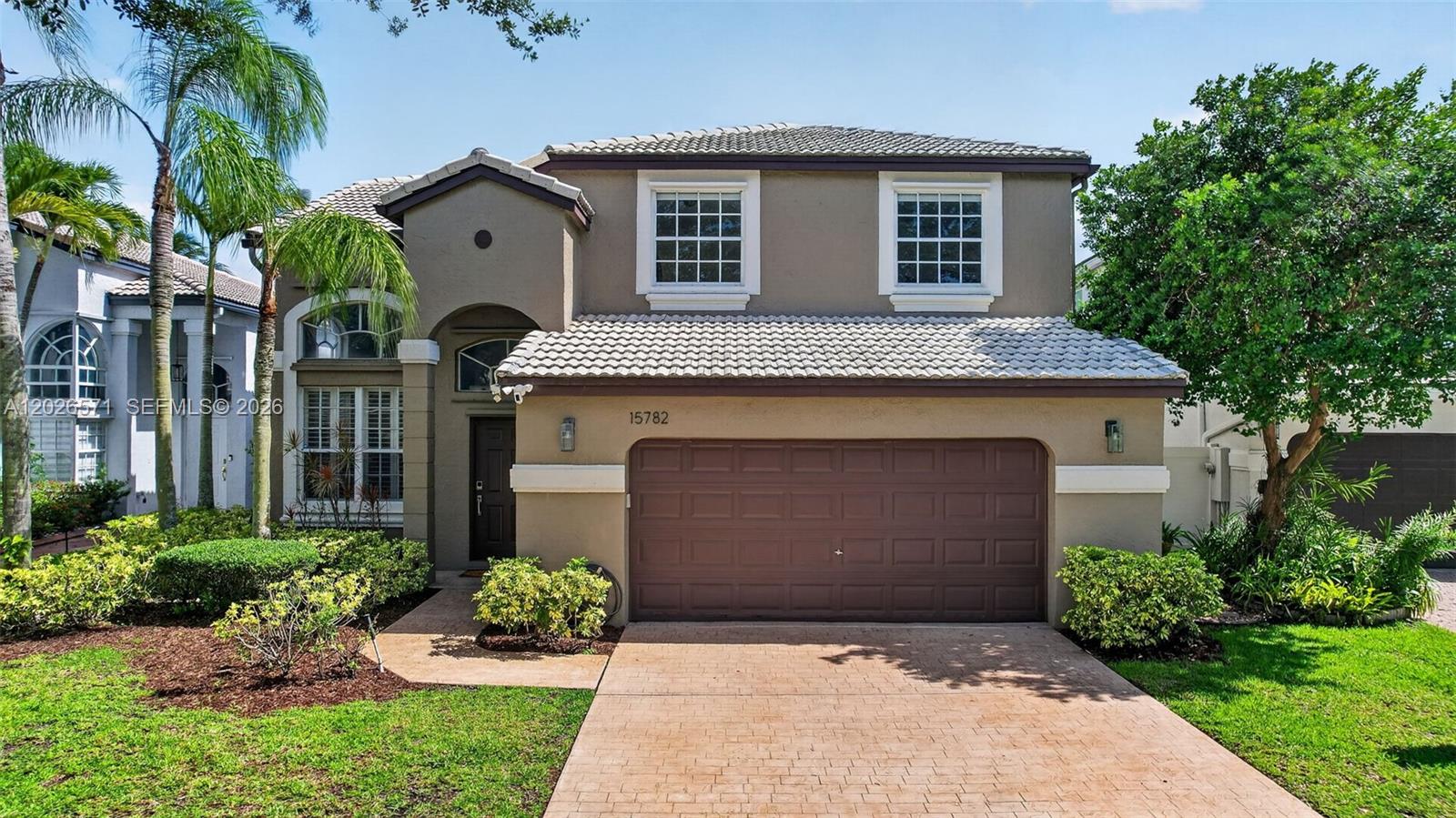 Welcome to your private waterfront retreat with both serene lake and resort-like pool views which create the perfect backdrop for your enjoyment and for entertaining. This 4 bedroom 2.5 bath pool home is meticulously maintained and has over 2,250 sq ft of living space with volume ceilings in the living room, wood floors throughout the first floor and staircase, and a modern kitchen renovated in 2021 with quartz countertops, white shaker cabinets, a large island, gold accents, and stainless steel appliances. The spacious primary suite features dual closets including a walk-in with custom built-ins. Primary bathroom has been tastefully updated with granite countertops, dual sinks, and an oversized shower with two shower heads. Big secondary bedrooms with ample closet space and custom built-ins. The half bath has also been tastefully remodeled. The backyard oasis is perfect for entertaining and includes a marble pool deck, pool, and tranquil lake views. AC replaced in 2018. Gated community with outstanding amenities including multiple pools, playgrounds, basketball courts, and more. Minutes to I-75 and close to restaurants, and shopping. HOA includes internet and painting of the exterior of the home every 5 years.