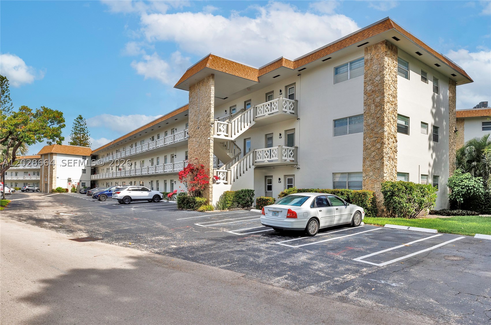 Enjoy comfortable and affordable Florida living in this bright and inviting condo! Featuring an open-concept layout with elegant Italian tile flooring, and an updated kitchen with white cabinetry, dark countertops, and a stylish backsplash. The spacious enclosed Florida room offers panoramic screened views of the peaceful courtyard, creating the perfect spot to relax. The cozy bedroom features attractive wood-look flooring for added warmth and charm. Residents enjoy resort-style amenities including a sparkling community pool, sun deck, shuffleboard and sports courts, scenic walking paths, BBQ areas, and convenient on-site parking. A wonderful opportunity to enjoy the Florida lifestyle!