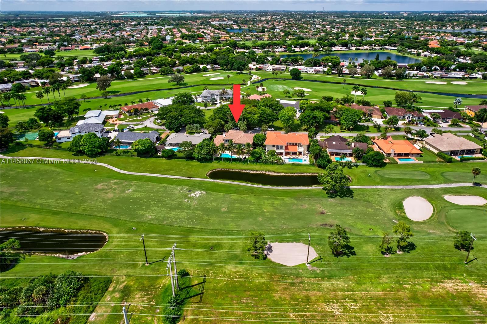 This amazing and gorgeous property is located in the prestigious Miami Country Club, on quite exclusive cul-de-sac road with a marvelous salt water pool with jacuzzi overlooking the golf course. NO HOA. This house features 5 bedrooms, 3 ½ bathrooms, office(can be used as a bedroom).Huge open concept living areas with 3 car garages and a driveway for up to six more cars.The spacious bedrooms feature walk-in closets, offering plenty of storage space.Impact windows and doors make this home safe, secure and energy efficient.Kitchen with granite counter tops, stainless steel appliances, double oven and wine fridge.Motorized banded shade in windows and doors.Central vacuum.Sprinklers system. Many tropical fruits and beautiful landscaping.  Come and discover all this beautiful house has to offer.