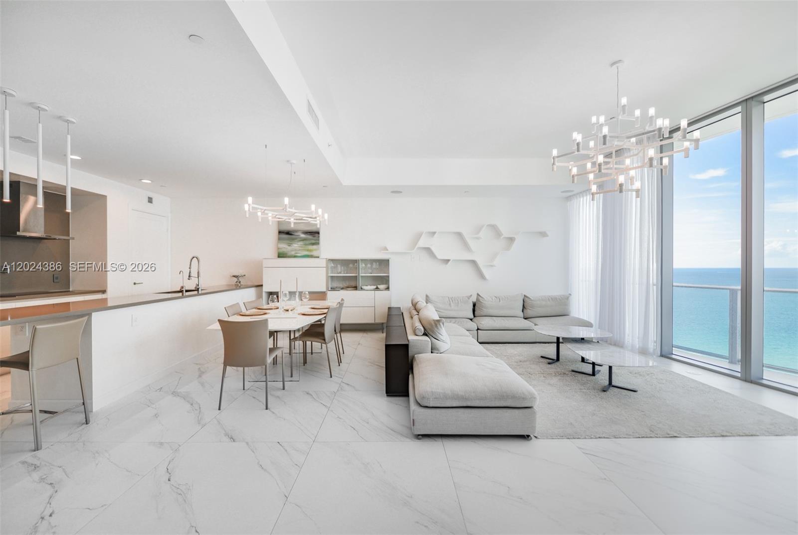 Spectacular panoramic views of the Atlantic Ocean, Intracoastal, and dazzling city skyline from this exceptionally sophisticated residence. This stunning 2-bedroom + den, 3-bath . Den has been thoughtfully converted into a spacious 3rd bedroom, offering both comfort and versatility.
Designed for elevated living, the residence features a state-of-the-art open-concept kitchen with premium high-end appliances, custom designer finishes, and sleek contemporary details throughout. Floor-to-ceiling windows and electric shades enhance both style and convenience.
Experience resort-style living in one of the most prestigious full-service oceanfront buildings in Sunny Isles Beach, featuring a private elevator entry, impeccable finishes, and world-class amenities. Residents enjoy infinity-edge pools, private beach service, a luxurious spa with sauna, steam rooms, massage facilities, a state-of-the-art fitness center, children’s playroom, elegant social lounge, cigar bar, private theater, and 24-hour concierge and valet services.