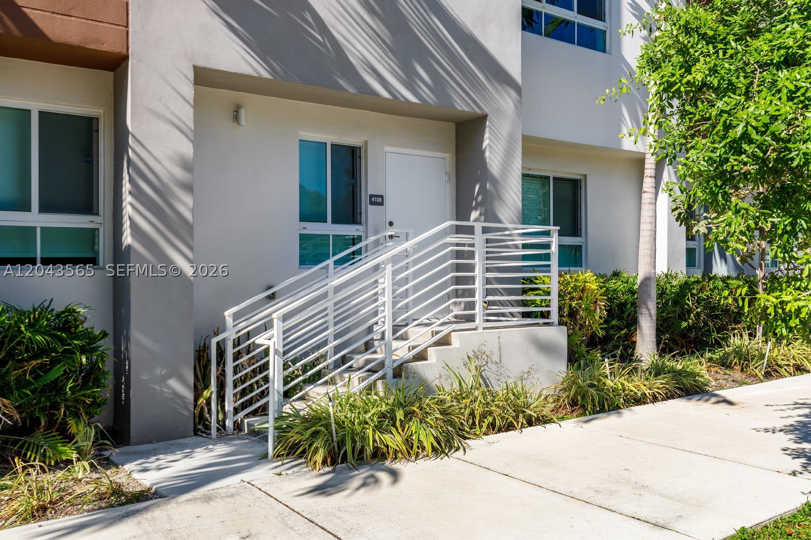 Modern villa-style condo in a small boutique community, featuring a convenient ground-floor entrance (no elevator). Ideally located near the new Aventura Brightline station, Aventura Mall, and a variety of shops, banks, and restaurants. The unit offers stainless steel appliances, an in-unit washer and dryer, blackout window treatments in all bedrooms, and abundant natural light. Community amenities include a pool.