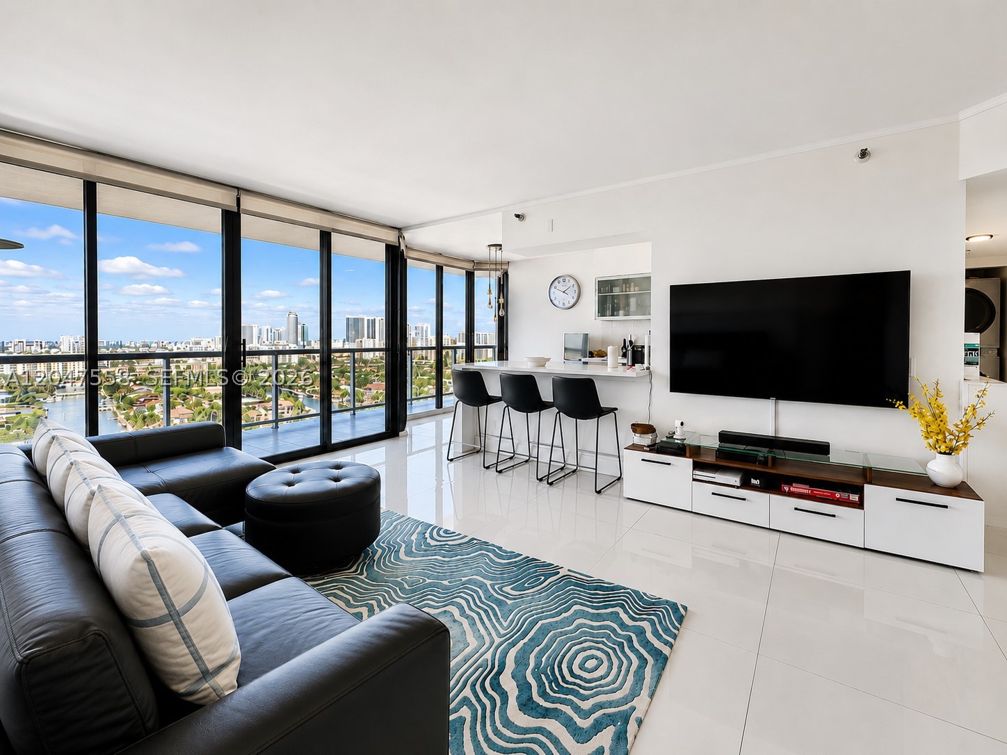 Welcome to Harborside at the Waterways—Aventura’s premier waterfront community. This spacious, renovated and FULLY FURNISHED 2-bedroom, 2-bath residence, positioned just below the penthouse in a coveted line, offers breathtaking, unobstructed skyline, & canal views from every room. Floor-to-ceiling windows provide abundant natural light year-round, while the expansive tiled terrace with glass railings creates seamless indoor-outdoor living with refreshing breezes.Freshly remodeled with updated kitchen, baths and porcelain floors, the home features a desirable split floor plan, generous bedrooms & walk-in closets, and formal dining space. The well-appointed kitchen offers ample space for casual dining or a breakfast nook with gorgeous views, . The primary bath includes a soaking tub, separate glass-enclosed shower, and double vanities. Additional highlights include 1 assigned covered parking space & Cable/WiFi included. Harborside has recently completed a stunning designer renovation of its common areas and offers resort-style amenities including 24-hour concierge, valet and security, upgraded fitness center, two heated pools, jacuzzis, saunas, BBQ areas, lounge, basketball, pickleball, and tennis courts. Ideally located in the heart of Aventura with private access to the Waterways Marina and shops, and minutes from Aventura Mall, Gulfstream Park, beaches, Brightline, dining, and entertainment. A rare combination of luxury, views, and value. Annual lease only (12-months)