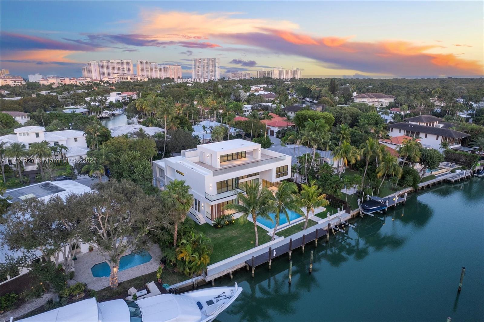 Discover unparalleled luxury at 960 Mariner Dr, Key Biscayne. This new architectural gem offers over 9,640 SF of living space, 7742 SF under air conditioning, on a 15,381 SF lot with 106 feet of water frontage. Featuring 6 bedrooms, 8 baths, and 2 half baths, the open-concept design boasts floor-to-ceiling glass, providing stunning views. A 4-person elevator connects all levels, including a third-floor terrace with 360-degree views of the water and Miami skyline. The chef’s kitchen, resort-style pool, summer kitchen, and private dock with direct Bay access make it perfect for entertaining. Boating enthusiasts will appreciate the ski boat crane. This estate combines modern elegance, privacy, and top-tier amenities in one of Miami’s most exclusive areas.