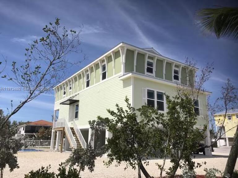 Beautifully situated in iconic Sombrero Beach, this open-water retreat showcases breathtaking ocean views with ever-changing shades of turquoise and deep blue. Offering 4 bedrooms and 3 bathrooms, the home is filled with charm and coastal character. A covered lanai provides the perfect setting for outdoor dining and relaxation, while the upstairs sun deck invites you to soak in sweeping water views and refreshing sea breezes. The spacious outdoor area is ideal for entertaining or simply unwinding in your own private oasis.
Located in a golf-cart-friendly, you can easily bike or walk to the grocery store and several of Marathon’s top restaurants—making this one of the most desirable areas in the Keys. Just a quarter of a mile away, you’ll also find a local golf course, adding even more recreational appeal right at your doorstep. Enjoy community gatherings at Sombrero Beach, including the famous Fourth of July celebration and fireworks. Weekly vacation rentals are permitted, offering excellent flexibility and income potential. Whether you're looking for a luxury vacation retreat, an income-producing property, or a full-time island residence, this is more than a home — it’s a lifestyle.
A rare opportunity in one of Marathon’s most sought-after neighborhoods, where privacy, panoramic ocean views, nearby golf, and the relaxed island lifestyle blend seamlessly. No Association.