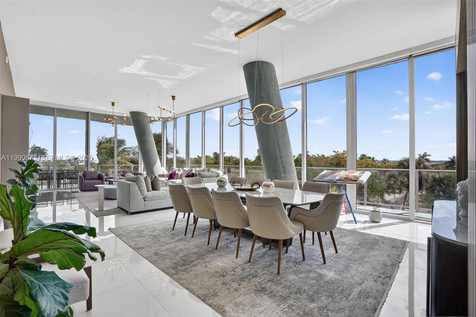 A rare opportunity to experience elevated living in Coconut Grove’s most iconic architectural masterpiece, Grove at Grand Bay. This expansive 5-bedroom, 5.5-bath residence offers approximately 3,950 SF of beautifully designed interior space, highlighted by custom Italian marble flooring and refined finishes throughout. Floor-to-ceiling glass fills the home with natural light, creating a seamless connection between indoor comfort and the lush surroundings of the Grove. The residence features generous living and entertaining areas, designed for both privacy and sophistication. Residents enjoy a full-service lifestyle with concierge, valet, rooftop pool, spa, and state-of-the-art fitness center. Perfectly positioned along South Bayshore Drive, just moments from waterfront parks, marinas, and Coconut Grove’s premier dining and shopping destinations. A truly exceptional home in one of Miami’s most desirable neighborhoods.
