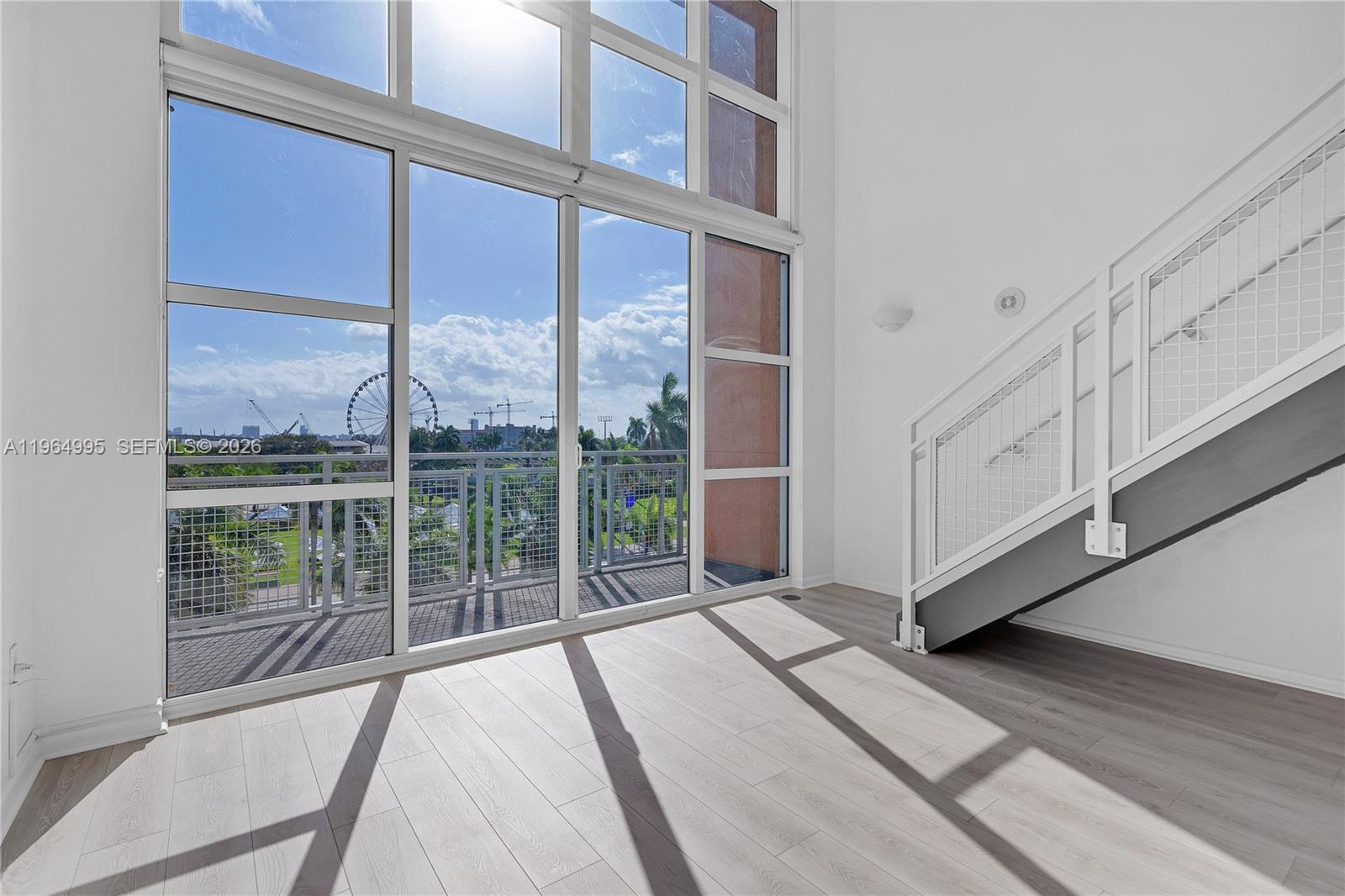 Indulge in panoramic views and contemporary living in this stunning bi-level 1 Bedroom 1.5 loft, boasting unparalleled eastern vistas across two stories. With soaring 19-foot ceilings and expansive floor-to-ceiling windows, natural light floods the space, creating an airy and inviting atmosphere. Step onto the balcony to savor captivating cityscapes, perfect for unwinding or entertaining guests. Situated across from the picturesque Bayfront Park, the vibrant Kaseya Center, and the shimmering Biscayne Bay, you'll find yourself at the heart of Miami's most coveted attractions. Experience the epitome of urban luxury living in this exceptional loft, where every amenity and convenience awaits. Don't miss your chance to immerse yourself in the vibrant energy of downtown Miami's premier location.
