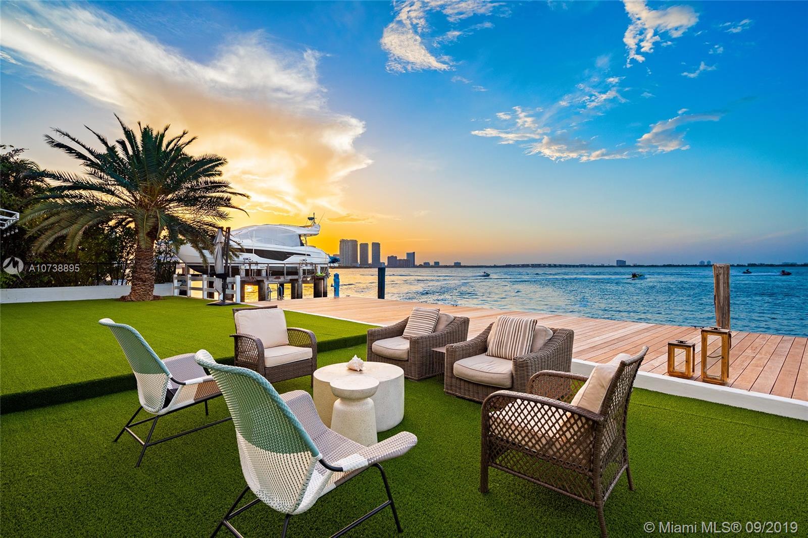 This amazing 2-story Bayfront home on San Marco Island, one of the Venetian Islands sits on an over-sized 13,382 SF lot w/approx. 105’ waterfront of open bay w/unobstructed views of the Miami & Miami Beach skylines. The 5BR/4+1BA home includes a separate 2BR/1BA guest apartment, spacious open living, family & dining room layout all w/stunning bay views. Gourmet kitchen sports top of the line appliances, blue pearl granite counter tops/backsplash & charming breakfast area. Bay-facing 2nd floor principal suite features a seating area, 18FT pitched wood beam ceiling & a private balcony that overlooks the open bay. Principal bath w/large walk-in glass rain shower, walk-in closet, cedar wood sauna & sunken spa tub. Expansive seating area for entertaining & 65’ Ipe wood dock.