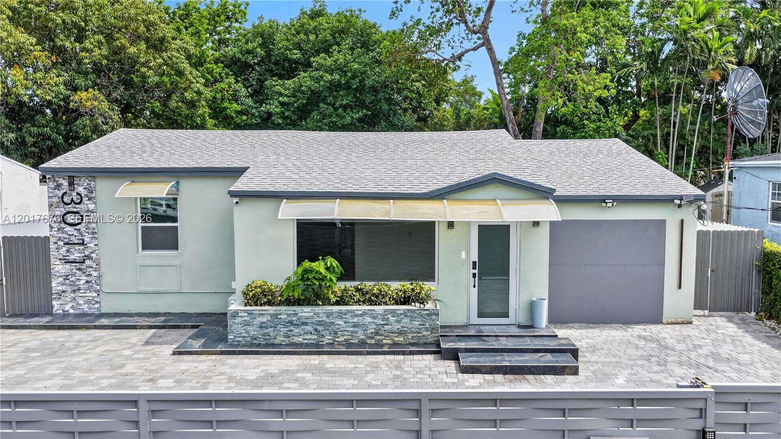 REDUCED !!! for quick sale !!!!! Welcome to a turnkey Miami gem where every detail has been thoughtfully updated for modern living. This fully renovated 3 bedroom, 2 bathroom single family residence showcases a contemporary open layout, designer flooring throughout, and a chef inspired kitchen anchored by elegant quartz countertops. Unwind in the primary bath featuring a luxurious soaking tub, and enjoy peace of mind with a brand new roof, impact ready windows and doors, and a private laundry room. Outside, an expansive backyard offers endless possibilities. Picture a custom pool, lush tropical landscaping, or an income generating in law suite. A motorized front gate enhances both privacy and street presence. Positioned in one of Miami's fastest appreciating corridors, you are just moments from the energy of Wynwood, Midtown, Edgewater, and Downtown, with seamless access to I-95, the Palmetto, and the airport. A rare blend of style, function, and location, this one won't last. property has a few open permits that need to be closed by new buyer. Please see attachment with violation list. Seller is selling as/is and will not be closing or clearing those items