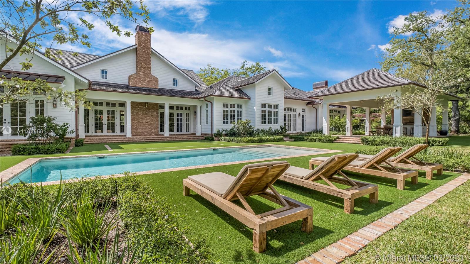 This magnificent marriage of Modern Farmhouse & Old Florida vernaculars make a seamless match. Sited close-in on 1 magical acre, the enchanting, oak-studded estate could as easily be set in Ocala Horse Country or even Louisville KY. All-NEW construction leaves no stone unturned. Gracious veranda & stately Mahogany front doors are both welcoming & dramatic. Vaulted timbered & 12-ft ceilings, wide-plank oak floors & exquisite attention to authentic detail define the timeless, understated interiors. Great rm; Family rm; Eat-in Wolf/SubZero Kitchen w/Coffee Bar & Butler’s Pantry. All Bdrms en suite w/Marble Baths; Master w/His&Hers Walk-ins. Library/Game/Cigar rm; Loft/Office; Mud rm; Laundry; Pool Bath; 3-car attached Garage. Summer Kitchen; 40-ft Resort Pool & more. Absolutely breathtaking!