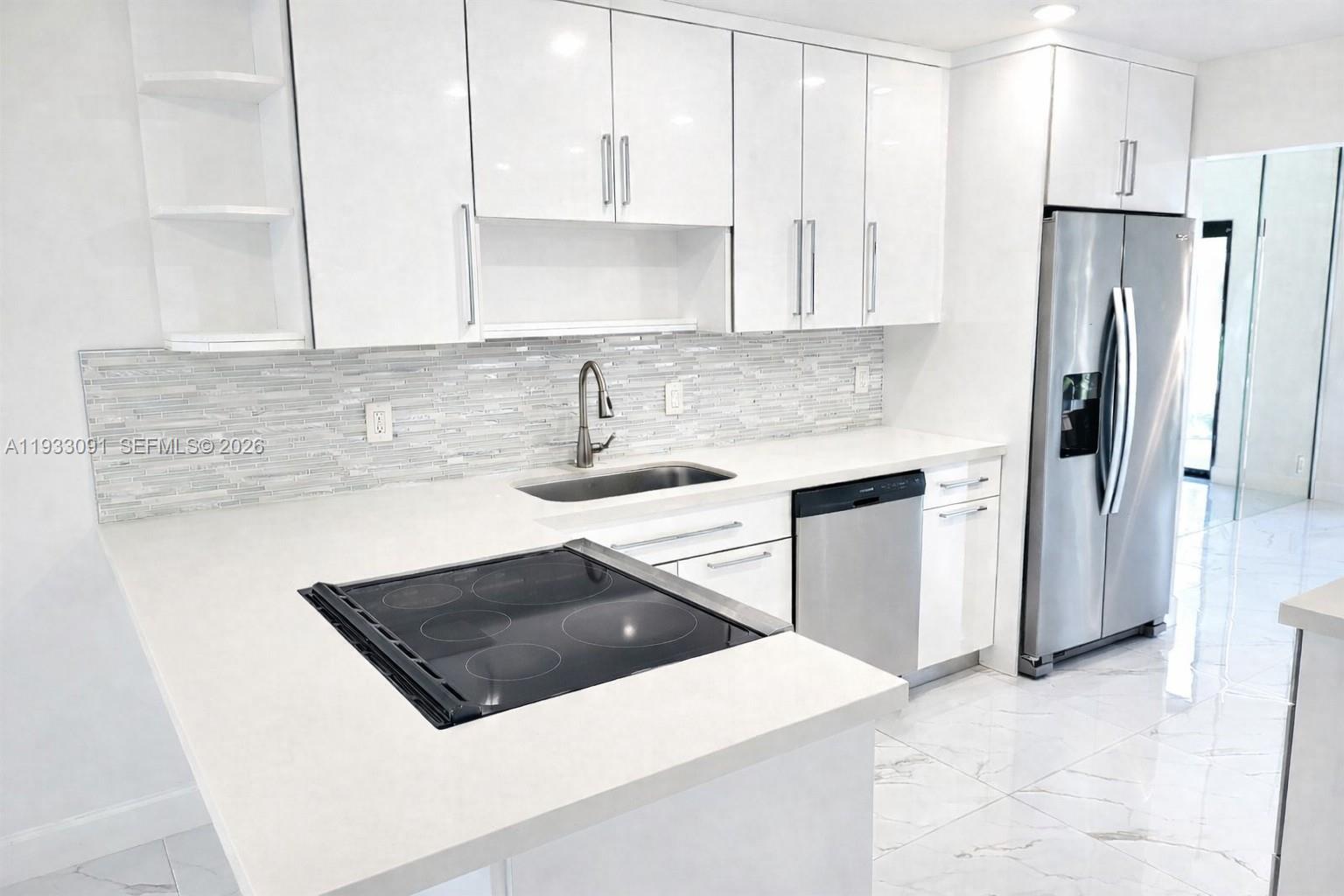Don’t miss the opportunity to own this move-in-ready, fully upgraded home with electric blinds, IMPACT WINDOWS & DOORS! Lots of natural light, this unit features one room on the lower-level ideal for a 4th bedroom, home office or gym. Enjoy cooking in the open-concept kitchen, entertain or unwind in the living and dining room with picturesque view of the water. Step onto the patio to enjoy serene waterfront views. The spacious primary suite includes an additional area ideal for a nursery or cozy sitting area, a walk-in closet, & luxurious en-suite with dual sinks. Additional bedrooms are generously sized, ensuring comfort for everyone. With two assigned parking spaces conveniently located right in front, this home is ready for you to move in and make it your own. Schedule your viewing today!!!