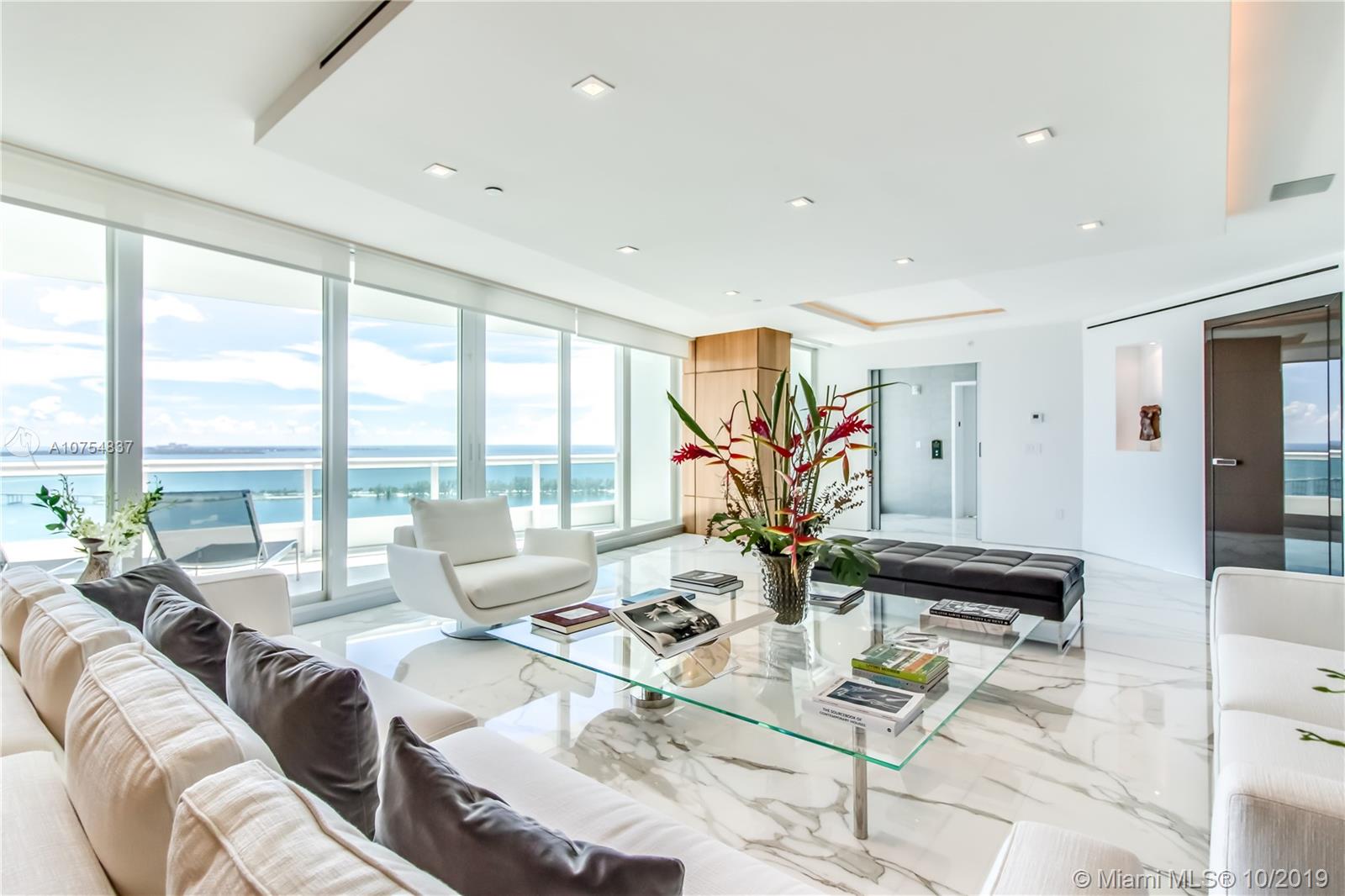 Outstanding renovation and re-design for this remarkable residence. The private foyer opens to a sun filled, flow thru living area offering views of the water and the City. High impact doors and windows, high ceiling with custom design and lighting. Poliform kitchen & baths. Calacatta gold marble & noce wood floors, Poliform custom paneling, master suite with his/her closets and his/her bath, 2 additional superb en suite bedrooms & staff service area. Large terraces on either side. This is truly a one of a kind unit.