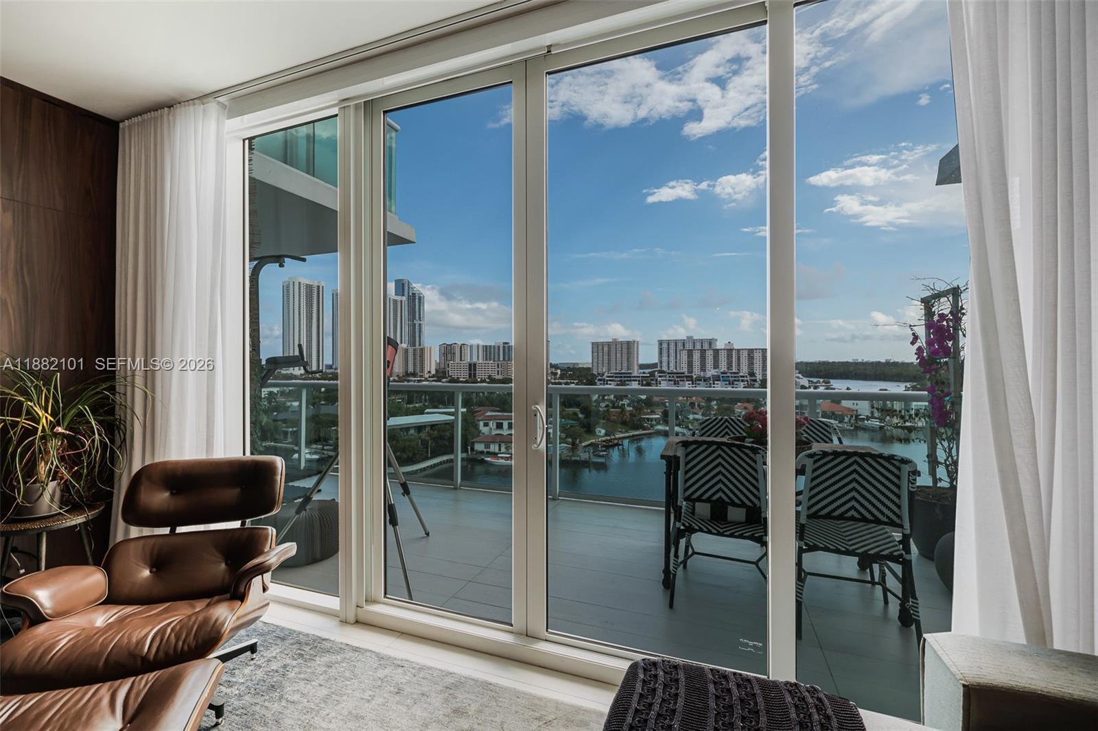 Luxury Waterfront Living! Experience the pinnacle of elegance in this stunning 3-bedroom, 3-bathroom duplex condo, impeccably designed and furnished by renowned designer Lu Marinho. Originally a 2-bedroom + DEN, the DEN has been converted into a private bedroom. The spacious master suite is situated on the upper level, featuring a luxurious en-suite bath and a walk-in closet. The lower level boasts an open-concept, a gourmet kitchen, and two additional bedrooms with full baths. Located in an exclusive waterfront community, this residence offers resort-style amenities, including: Spa & Fitness Center, private marina & boat storage, serene zen gardens, an expansive pool deck for relaxation and a Tennis court.