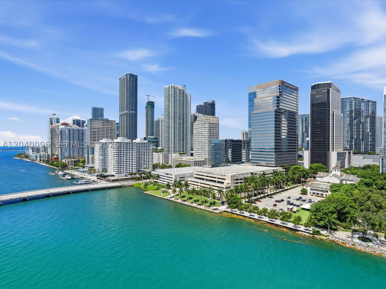 100% Remodeled Apartment with Stunning Direct Bay Views + Beautiful Brickell Skyline Views in Guard Gated Brickell Key! Amazing Open Floorplan and High-End Finishes throughout! The New Kitchen features Stunning Quartz counter tops & White Cabinets with brass handles and a high-end brass faucet that gives the unit a Modern & Sophisticated look! The Kitchen also feautres Hi-End Stainless Steel Appliances, Wine Cooler and Cozy Breakfast area!  All of the Bathrooms have been meticulously & elegantly updated as well including Custom Mirrors, Brass Accents and a Beautiful, Floating Double Vanity in the Master Bathroom.  Other features include: Porcelain Floors throughout, Upgraded Lighting, Custom Doors & Closets and 2 Large, Bayfront Balconies for Entertaining and Relaxing! Building amenties Include: Indoor Raquetball Court, Billiard Room, Bike Room, Business Center, Sauna, Heated Pool, Hot Tub, BBQ Area and 2-Story Fitness Center!  Unit includes 2 Parking Spaces + 1 Storage.  SHOWS LIKE A MODEL!