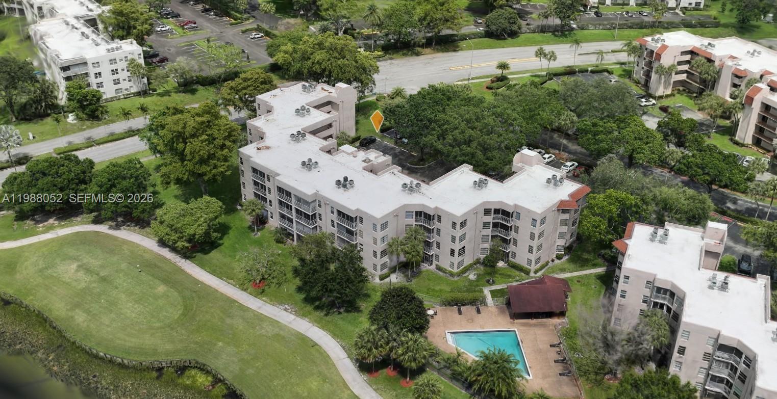 Rare 4th floor corner 3/2 condo, 1,170 SF in sought-after Pine Island Ridge! Split bedrooms, walk-in closet, screened Florida room w/ garden view & in-unit W/D. Leased through January 2027 — immediate income from day one. Resort-style country club community: golf, tennis, fitness, sauna, 2 restaurants & more. HOA covers cable, water, insurance, elevator & reserves. Assigned parking. A-rated schools. Minutes to NSU, I-595 & FLL. Priced to sell!