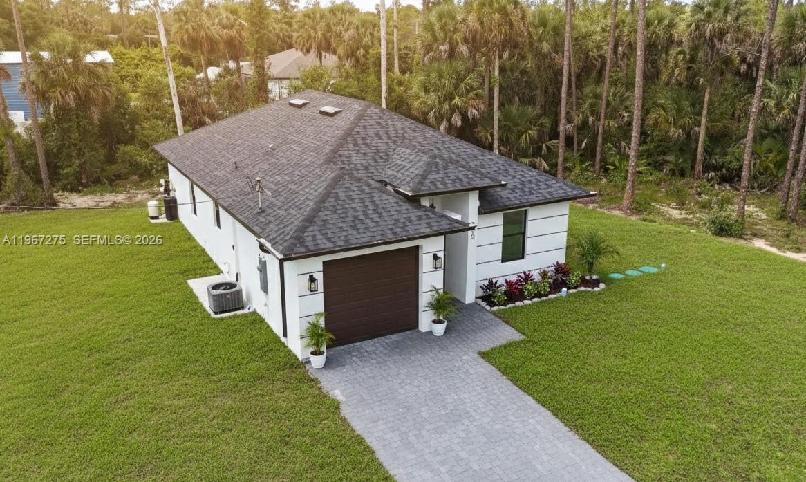 Experience the perfect blend of modern luxury and total peace of mind in this stunning 2025 NEW CONSTRUCTION. This home showcases a bright open-concept layout with premium quartz countertops and high-end LG appliances, and stylish ceramic tile flooring throughout, creating an elegant yet durable space ideal for both: family memories and the modern professional. 
For maximum convenience and a truly move-in-ready experience, the home includes a brand new washer and dryer, eliminating extra costs and stress from day one.  Designed for superior protection and efficiency, it features full hurricane-impact windows and doors, helping reduce insurance and energy costs. Situated on a spacious 0.25-acre lot with NO HOA, there is plenty of room for a pool, RV or boat storage, open to any future expansion, this property offers freedom, comfort, and long term value.