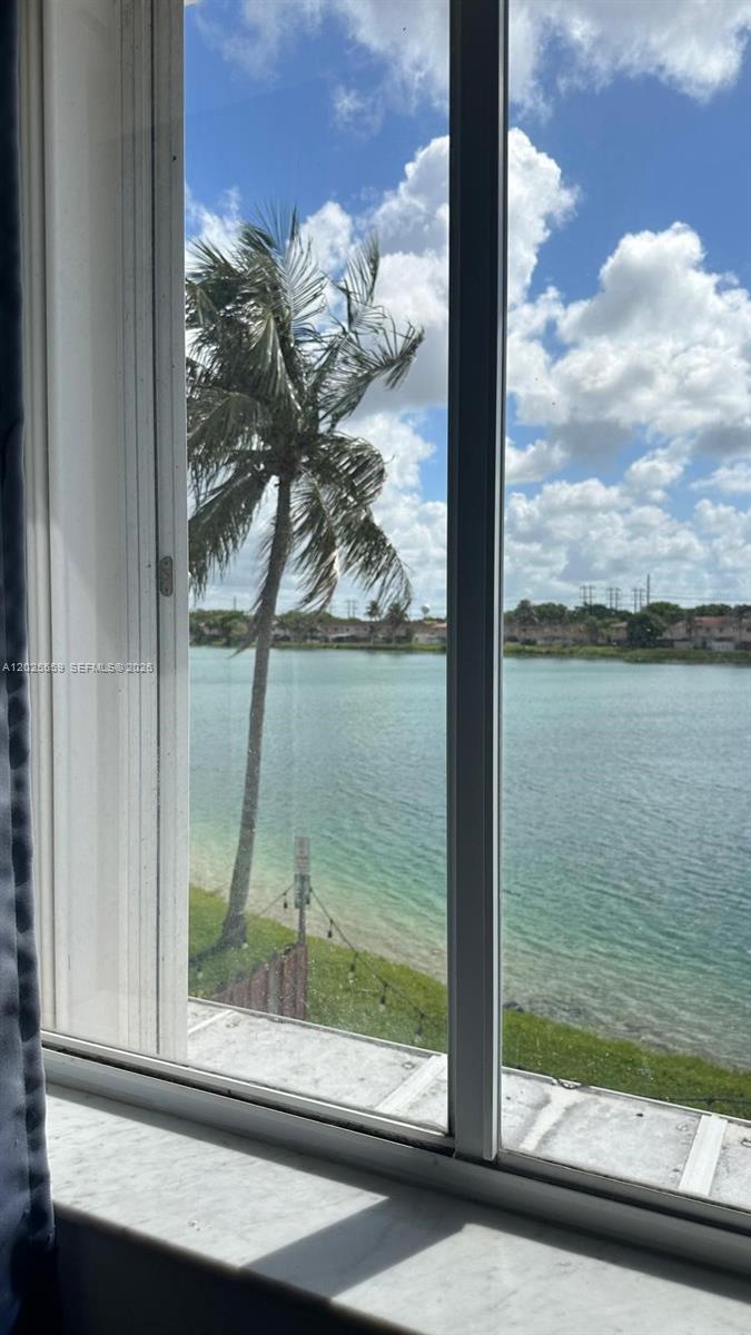 Corner unit for extra privacy. Beautiful lake view in a great very peaceful neighborhood with pool and greenery. Unit has tile and wood/laminate floors, private patio plus 3 bedrooms, 2 1/2 baths. Front assigned parking for 2-4 cars.  Call L.A. to show by appointment