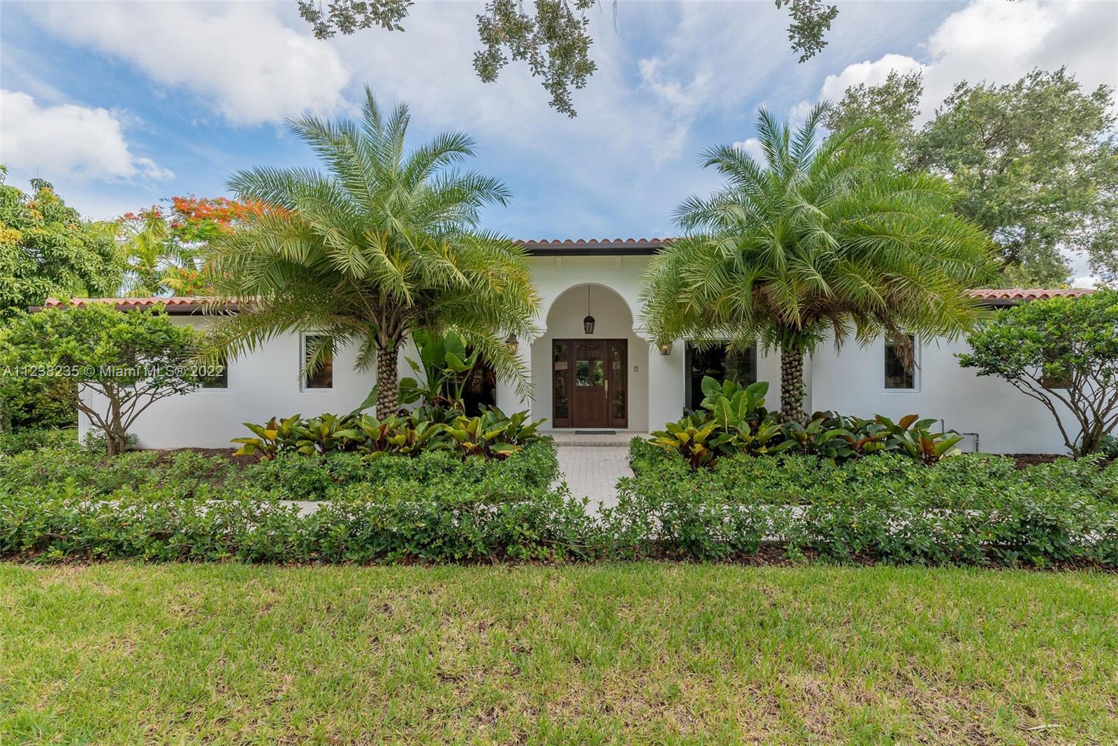 On a quiet Pinecrest street, this 3/3.5 is the ideal home for gatherings. The property features a beautiful custom-designed wine cava, natural stone bar, chef's kitchen with solid wood custom cabinetry, marble flooring, a stunning natural coral wall with fireplace, and much more. The scenic impact windows allow for beautiful views of the pool and expansive outdoor areas. The home was fully remodeled in 2021 with everything from plumbing to roof and appliances. Attached is a list of additional features. Use show assist. 
*A PER OWNER AND ARCHITECTURAL PLANS TOTAL SQFT IS 4350*