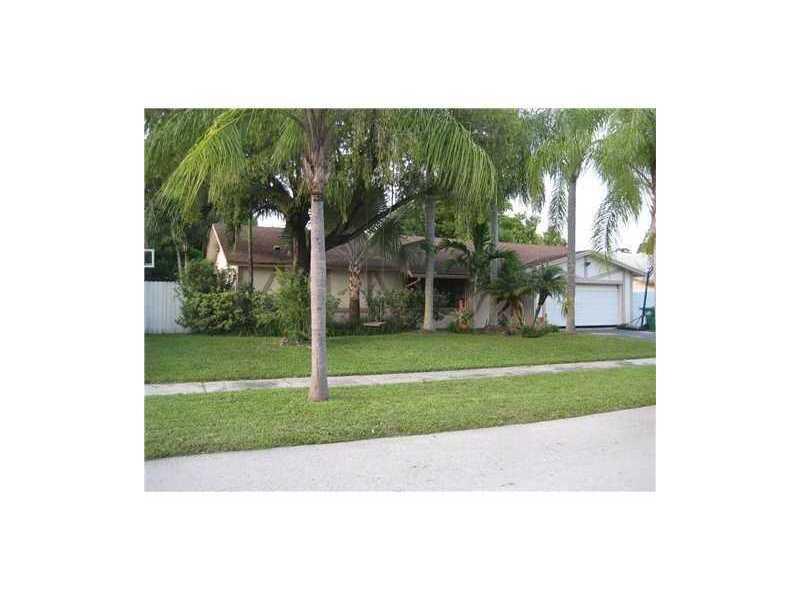 Private lush landscaped backyard has pool w/ cascade waterfall surrounded by palm trees. Warm home has wood laminate floors throughout. High vaulted ceilings in living & dining rooms. Large master suite has 2 walk-in closets & doors to pool area. White ki tchen cabinets w/ stainless steel appliances. Formal dining room with arched entryway. Brand new beautiful guest bathroom. Plus spacious 2 car garage. Huge attic w/ drop down latter. Alarm system. Non-smoking tenants only.