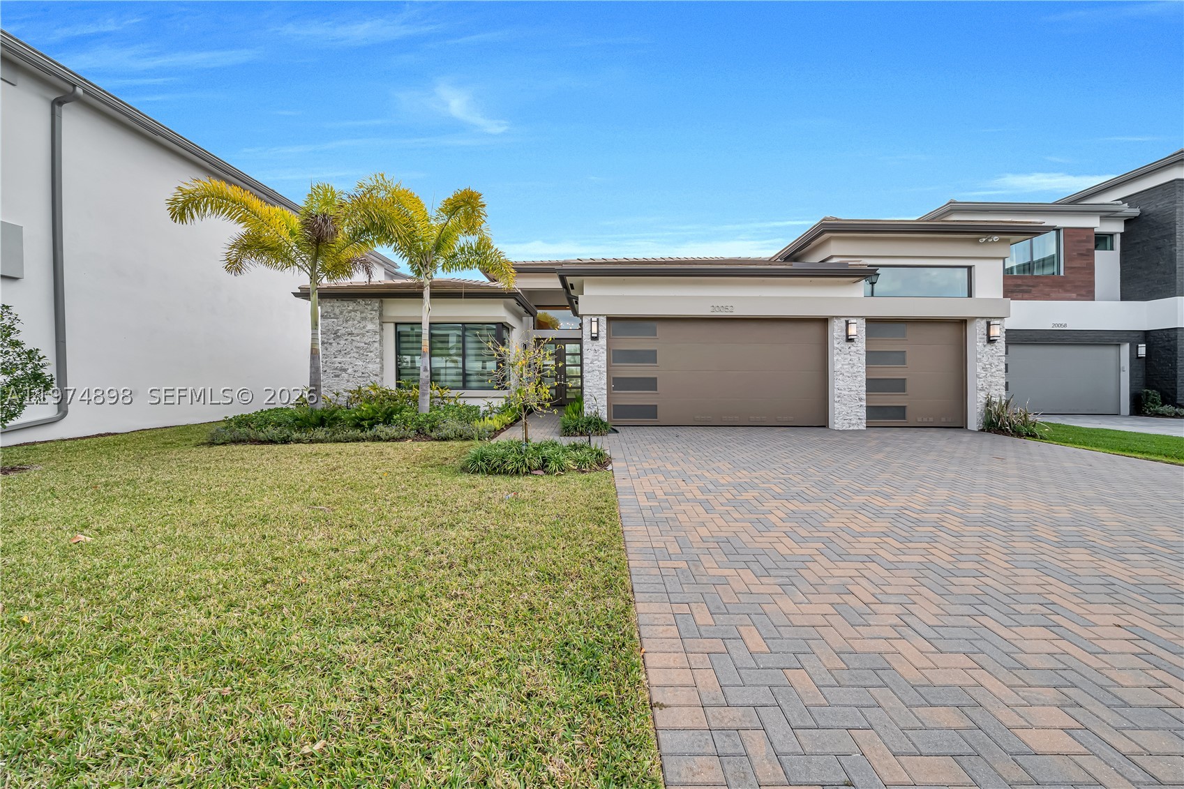 Welcome to 20052 Pacific Dunes Dr — a move-in ready, Designer finished and fully furnished 2024 construction in Boca’s premier Lotus Palm community. This stunning 4BR + den residence features a desirable west-facing front exposure, refined high-end finishes, and a durable concrete S-tile roof. With over 4,100 total square feet, the thoughtfully designed layout offers expansive living spaces and sits on a generous lot with ample room to entertain. 

Boasting over $200,000 in custom designer finish upgrades, this home has been thoughtfully elevated well beyond builder grade. The large, beautifully appointed kitchen is ideal for entertaining and everyday living, showcasing elevated materials, modern detailing, and a clean, sophisticated aesthetic throughout.

The luxurious primary suite serves as a private retreat, featuring a spa-inspired bathroom with dual vanities, sleek contemporary finishes, and an oversized spa shower designed for a truly relaxing experience. A separate laundry room adds everyday convenience and functionality.

Enjoy resort-style amenities in a prime Boca Raton location — the perfect blend of comfort, style, and sophistication. Property is Fully furnished.