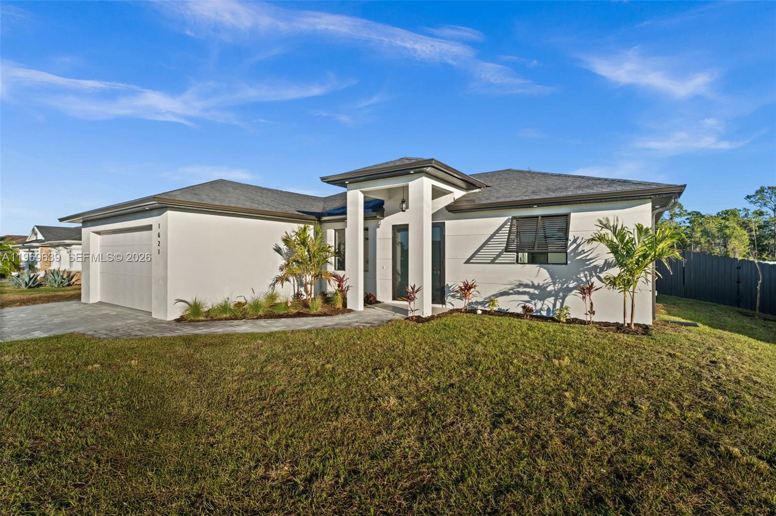 Welcome to the "Moonstone" Model. This amazing home is the perfect blend of value, comfort, luxury, style, and security. This beautiful new construction is built for everyone who wants to live with all the comforts of 'home.’ Impact windows and doors, European style kitchen featuring soft closing cabinet doors, drawers and Bloom hardware, high-end appliances, double oven, hood, cooktop, wine cooler, and much more. Master bedroom with custom designed built in walk-in closet, master en-suite with glass shower enclosure, double vanity, and linen closet. Two spacious bedrooms with walk-in closets, guest bathroom with glass shower enclosure. Home offers open concept layout with 10-foot-high interior ceilings, 8-foot-high designer doors. Outdoor kitchen with marble countertops and 1/2 bath by the pool, ready for enjoyment 12' x 24' beautiful pool with Sun Ledge, 2 car garage, washer, dryer, and laundry sink. "NO FLOOD INSURANCE NEEDED". Engulf in the multitude of upscale details that you must see to appreciate. Enjoy your day by the pool or explore everything Cape Coral has to offer. Do not miss out on this one-of-a-kind opportunity! Schedule your showing today and make this beauty your home!