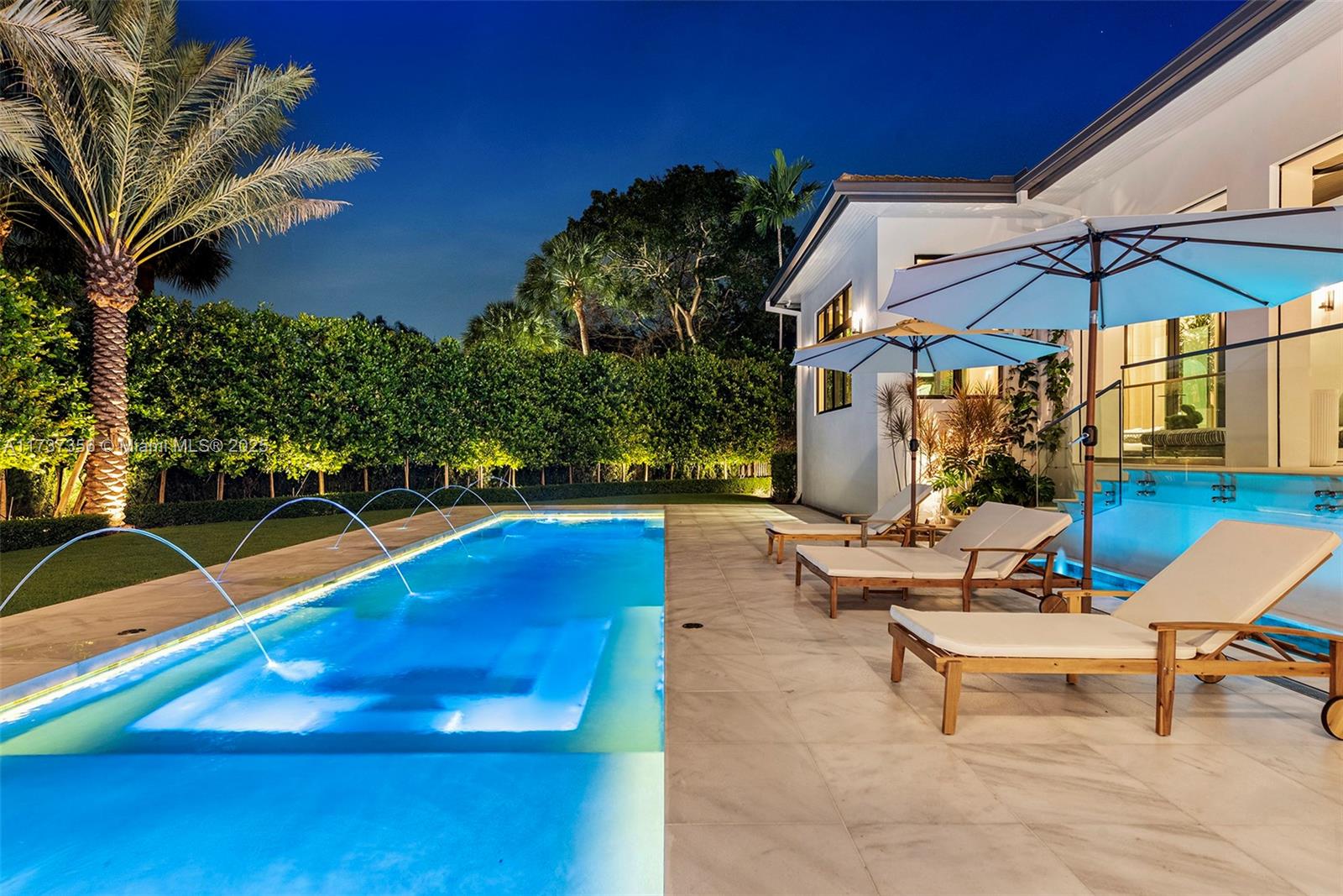 Miami meets Milan in this visionary private gated villa—an exquisite fusion of timeless elegance, modern design & cutting-edge innovation. Every inch of its 8,250+ sqf is masterfully curated, from custom interiors of unrivaled luxury to state-of-the-art security & technology making each room a destination with an inviting experience. Rebuilt as NEW CONSTRUCTION in 2024, this luminous sanctuary features a stunning kitchen, a second catering kitchen, a serene primary suite, limestone floors, white oak finishes & a resort-style pool. Lush gardens & a stunning cabana with a kitchen complete the retreat. 13’ ceilings, book-matched marble baths & extraordinary Hector & Hector millwork define sophistication. Iconic designer furnishings make this an ethereal TURNKEY masterpiece in coveted Cocoplum