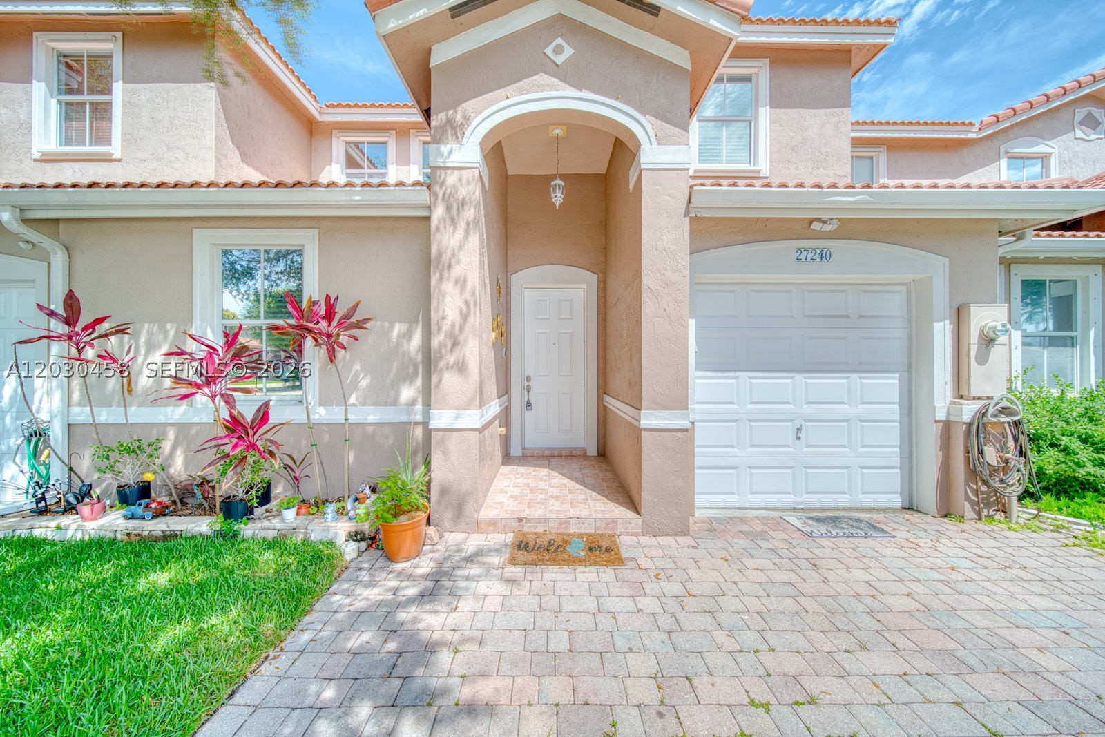 Discover the incredible potential of this spacious two-story townhouse featuring 4 bedrooms, 3 full bathrooms, a 1-car garage, and a large driveway that easily accommodates up to 3 additional vehicles. Fully tiled throughout, the first floor offers a highly functional layout ideal for guests or multi-generational living, boasting a private bedroom with a full bathroom, a separate living room, and a family room featuring a kitchen equipped with stainless steel appliances. For peace of mind, the A/C was replaced in 2026, and the home features a newer washer and dryer. Upstairs, you will find a generous primary suite complete with elegant tray ceilings and dual his-and-hers closets, alongside the additional bedrooms. Perfectly situated just steps from the community clubhouse and pool, this home is nestled within a secure, gated neighborhood with a remarkably low HOA fee of just $160 per month. Easy to show by appointment. Contact us today to schedule your private tour!