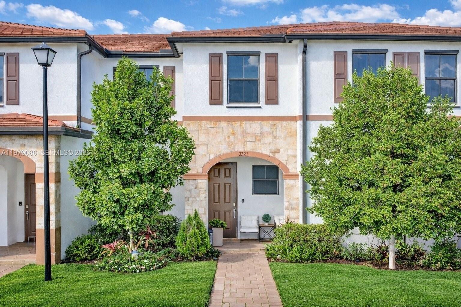 THE UNICORN OF AQUABELLA. This substantially renovated 2019 residence (3BD/2.5BA) boasts the community's most coveted location. Enjoy unparalleled views facing the green space and playground, allowing you to watch your family play from your doorstep. Experience total privacy with NO REAR NEIGHBORS and solve the parking dilemma with abundant guest spots right at your door—a rare luxury. The interior is move-in ready, featuring brand-new wood flooring on the main level (no carpet!) and a sleek open-concept layout. Enjoy 24/7 guard-gated security and elite resort amenities. Won't last!