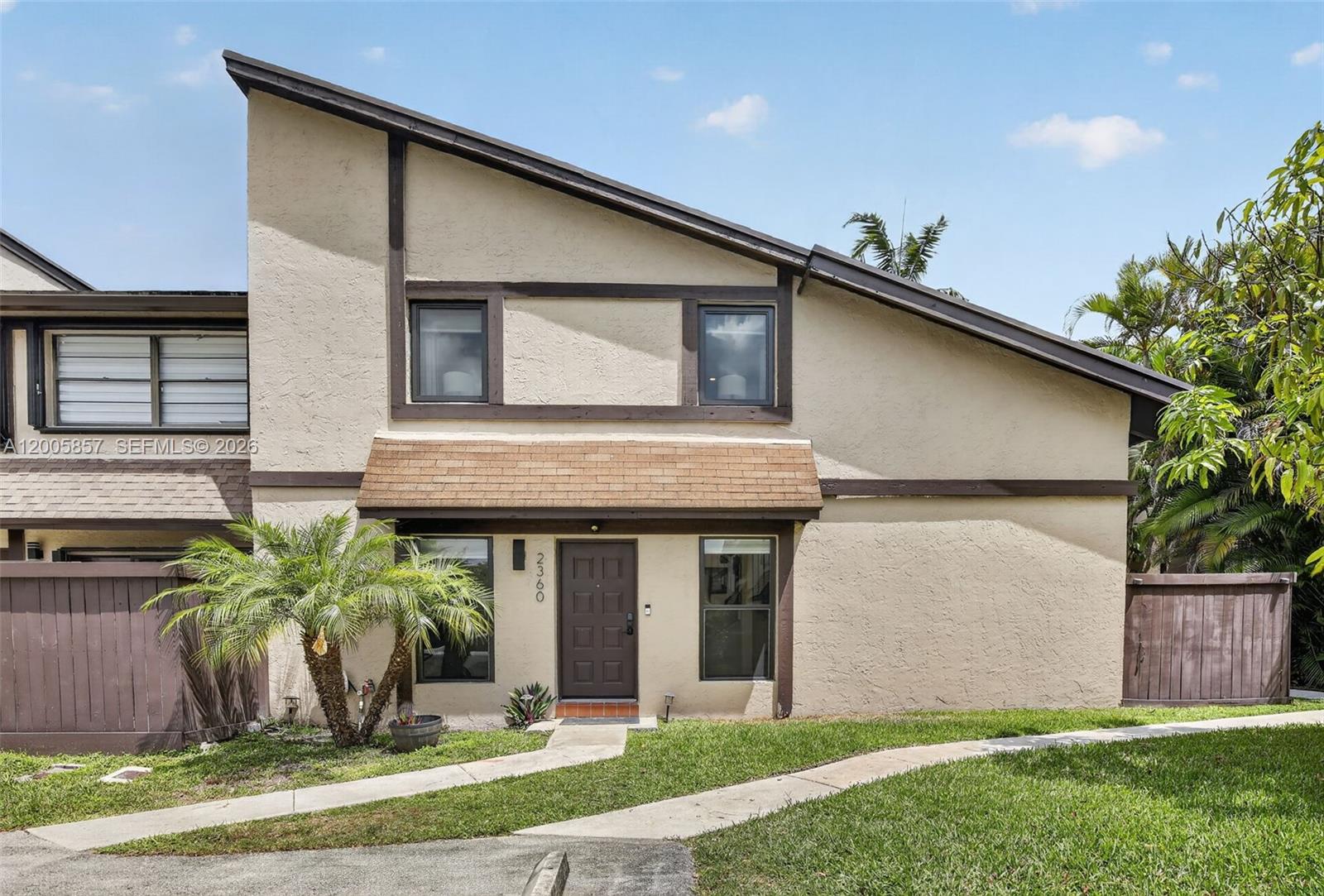 OPEN HOUSE 06/13/2026 (12:00pm - 2:00pm) Located in the heart of Pembroke Pines, this charming 3/2 two-story corner townhouse in Bayberry Lakes offers 1,450 square feet of updated, move-in-ready living space. The interior is complemented by soaring vaulted ceilings and an abundance of natural light, highlighting a modern aesthetic with new flooring, fresh paint, and a contemporary kitchen equipped with premium stainless steel appliances. The 2nd floor layout includes 2 large split bedrooms with 1 full bath. The first floor 3rd bedroom was converted into a sitting area but can be converted back and it is complemented by its own full bathroom which can make it an ideal suite for guests or multigenerational living. Outside, the large private fenced patio offers a serene retreat with the unique potential to create a custom wraparound porch for seamless indoor-outdoor entertaining. Bayberry Lakes is a pet-friendly community with low HOA fees that includes cable tv and no rental restrictions, making it a perfect option for homeowners and investors alike. This home includes two assigned parking spaces plus guest parking and is just minutes away from the premium community amenities, including a clubhouse, pool, jacuzzi, playground, and sports courts. Perfectly located just minutes from top-rated schools, the Hard Rock Hotel, luxury shopping, hospitals, and major highways. Just bring your belongings and settle right into this turn-key home!