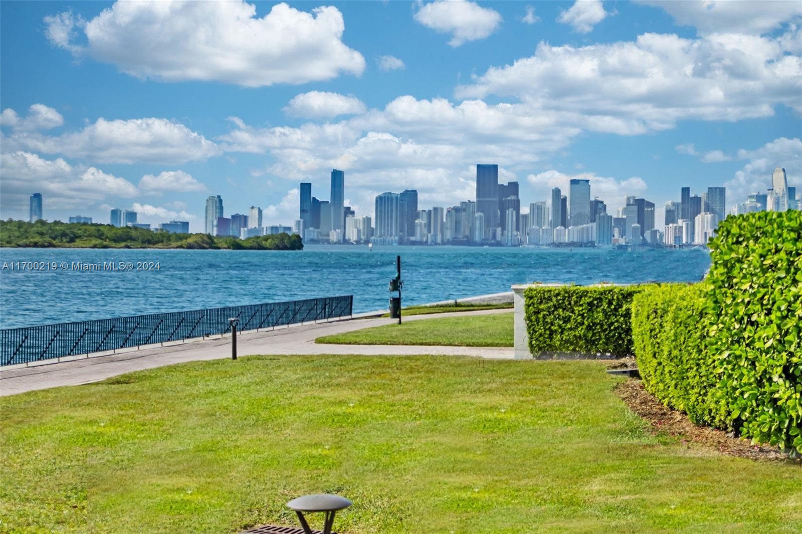 Impeccable ground level 3BR, 3.5 baths on Bayside. Updated in 2019 with contemporary relaxed decor, and luxurious finishes, pristine marble floors throughout, 10.5ft ceilings, OPEN chef kitchen features marble countertops, stainless steel appliances, built-in custom cabinetry, an updated SONOS media system, and Smart Home.  Garage space(s) feat. brand new Tesla Charger, two best parking spaces, golf cart space, and Garia golf cart.  Conveniently located adjacent to the pool.  “D” model is one of the most sought-after split bedroom floor plans on the Island boasting a deep wraparound terrace with stunning panoramic Bay and city skyline views and mesmerizing sunsets. All windows and doors are impact glass. New central​​‌​​​​‌​‌​​​‌‌​​​‌‌‌​​‌​​‌‌​​​​ VAC.