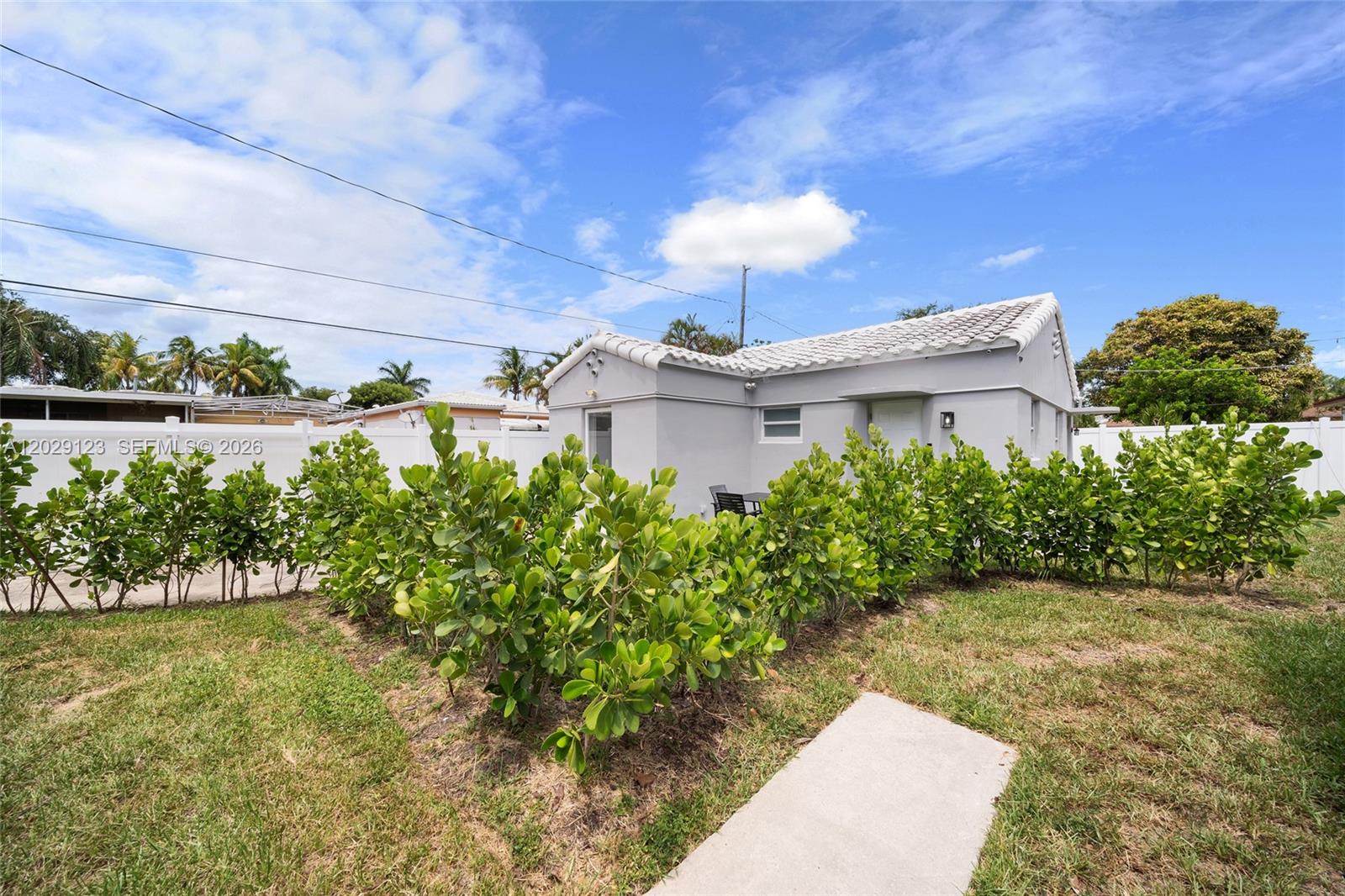 Updated 2 bedroom, 1 bath home! COMPLETELY REDONE on the ICONIC Hollywood Blvd only a mile from HOLLYWOOD BEACH and BOARDWALK!. Impact Windows, NEW Roof, New Kitchen, New Baths, New Flooring etc. 2 car driveway! Only two blocks to Young Circle, groceries, shopping and the nightlife of downtown Hollywood. Available Immediately. A must see!