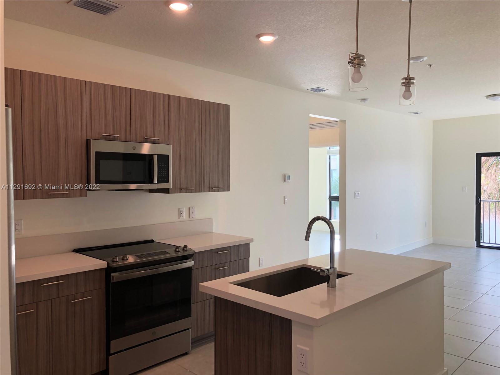 Beautiful 3/2 CORNER FIRST FLOOR condo at Urbana - Downtown Doral - Close to Publix, Downton Doral restaurants, short drive to the  airport, walking distance to city place, close to many parks for children and outdoor gyms for adults. Stainless steel appliances. Luxury clubhouse, resort style pool, two floor gym, full indoor basketball court, indoor track, pool table, game room with a ping pong table,  business center, event halls for parties and more. High Impact windows and doors. Washer and Dryer in the unit. EASY TO SHOW