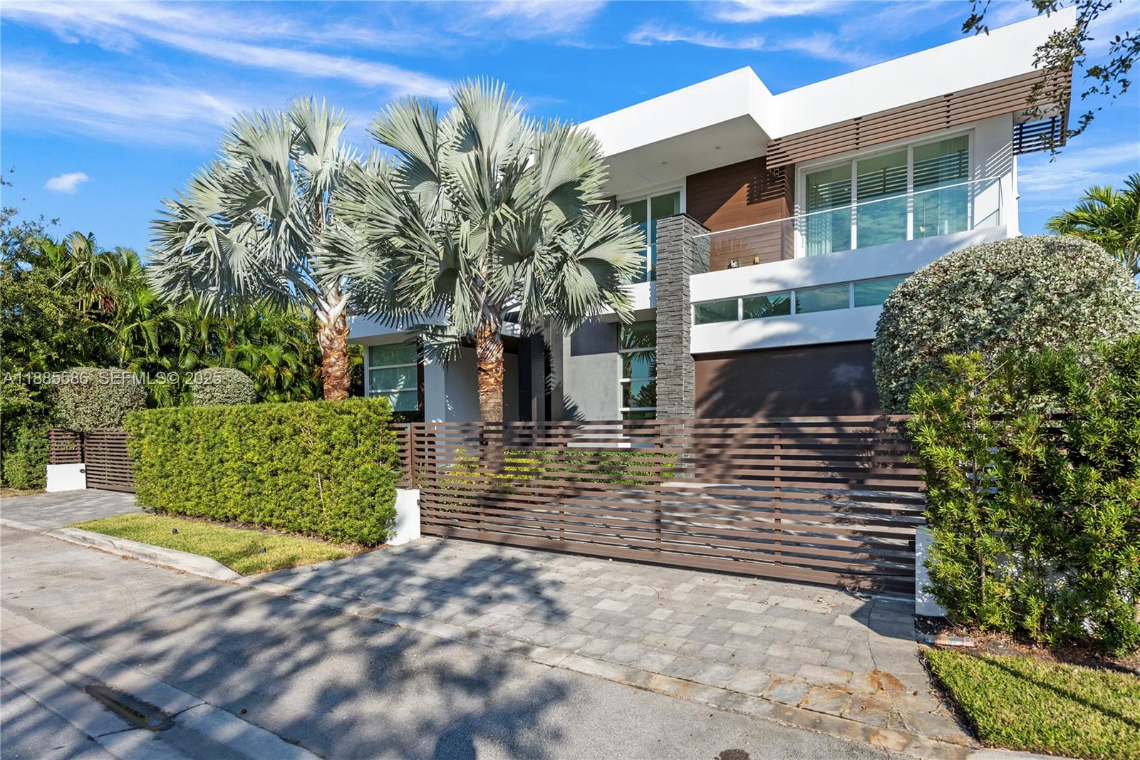 1261 99th St in Bay Harbor Islands is an exceptional 8-bedroom, 8.5-bath residence offering the perfect blend of space, luxury, and comfort. Designed for modern living, the home features expansive interiors with elegant finishes, abundant natural light, and seamless flow throughout. The gourmet kitchen, spacious living areas, and oversized bedrooms make it ideal for both family living and entertaining. Step outside to a private backyard oasis with a sparkling knife edge pool, lush landscaping, and covered lounge areas. Move-in ready and perfectly located near Bal Harbour Shops, top-rated schools, and the beach.