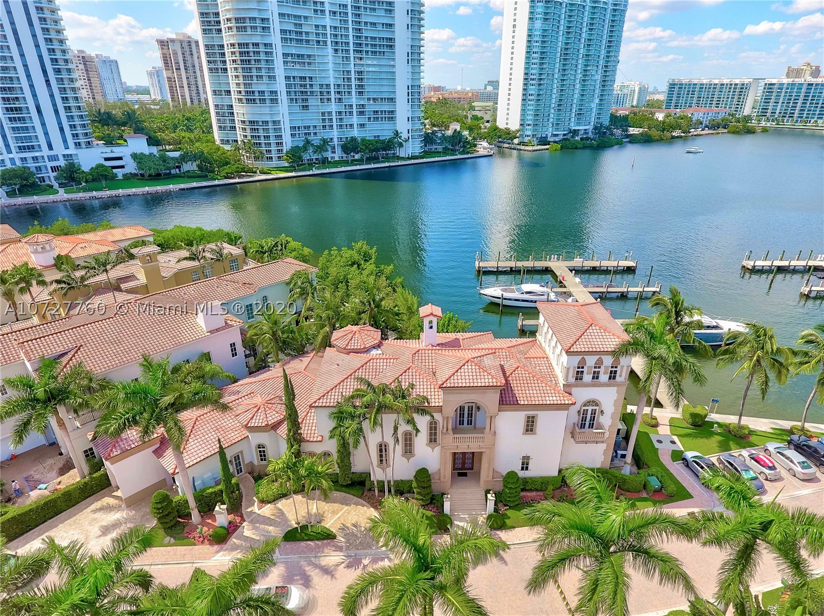 AVENTURA MOST EXCLUSIVE WATERFRONT VILLA IN THE PRESTIGIOUS, PRIVATE GATED COMMUNITY OF ISLAND ESTATES. CELEBRATED OPULENCE & TIMELESS LUXURY IN THIS MEDITERRANEAN MANSION WITH 6 BR/8.5 BA, OVER 7,300SQFT  WATER VIEWS, PRIVATE MARINA. GREAT FOR ENTERTAINMENT OPEN FLOOR PLAN, HIGH CEILINGS,  ELEVATOR, DUAL HUGE MASTER BEDROOMS, WINE ROOM, WET BAR, FIREPLACE, STEAM SHOWER, HEATED POOL/SPA, GOURMET & OUTDOOR KITCHEN, 2 STORY FOYER, OUTDOOR TERRACE, 50' BOAT SLIP INCLUDED DEEDED DOCK. A TRUE OASIS, LIVE ON YOUR OWN PRIVATE ISLAND . ENJOY THE AMENITIES OF PRIVE FIVE START RESORT, TENNIS COURTS, SPA, INDOOR LAP POOL, HAIR SALON, 3 RESTAURANTS, CIGAR LOUNGE, MARINA FOR YACHTS, KIDS PLAYGROUND, DOGGIES HILL PLAY AREA, WALKING/RUNNING TRAIL & MUCH MORE!!