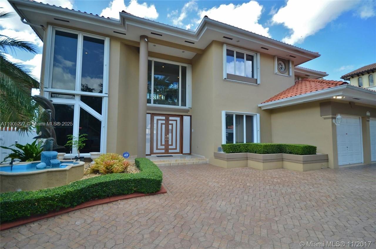 Spectacular 5-bedroom, 5-bathroom lakefront estate nestled within the prestigious, guard-gated Royal Oaks community of Miami Lakes. his elegant residence showcases a brand-new, sophisticated front door, a recently installed brand new roof (just two months old), and an upgraded air conditioning circulation system less than a year old—together representing a $100,000 investment in modern comfort and style. It features 8ft ceilings with gorgeous chandeliers, California closets, and marble floors throughoutt (excluding the master suite and downstairs bedroom) The European style kitchen featuring contemporary finishes, a custom-designed bar, and views of the lake. The HOA fee is $360 Per year.