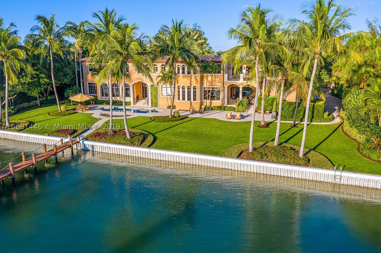 Located on the south end of Jupiter Island, this magnificent and meticulously maintained property offers convenient and quick access to the south bridge. 480 S Beach Road sits on 200' of direct Intracoastal and features wide water views and more than 7600 sq ft of living space. The house was updated in 2011 and includes 6 bedrooms, 8 full bathrooms, 2 half baths, wine cellar, summer kitchen, a guest house, deeded beach access, impact windows and doors and much much more. Surrounded by beautiful lush tropical landscaping. Deep water dockage over 8' and minutes to Jupiter Inlet with no fixed bridges.